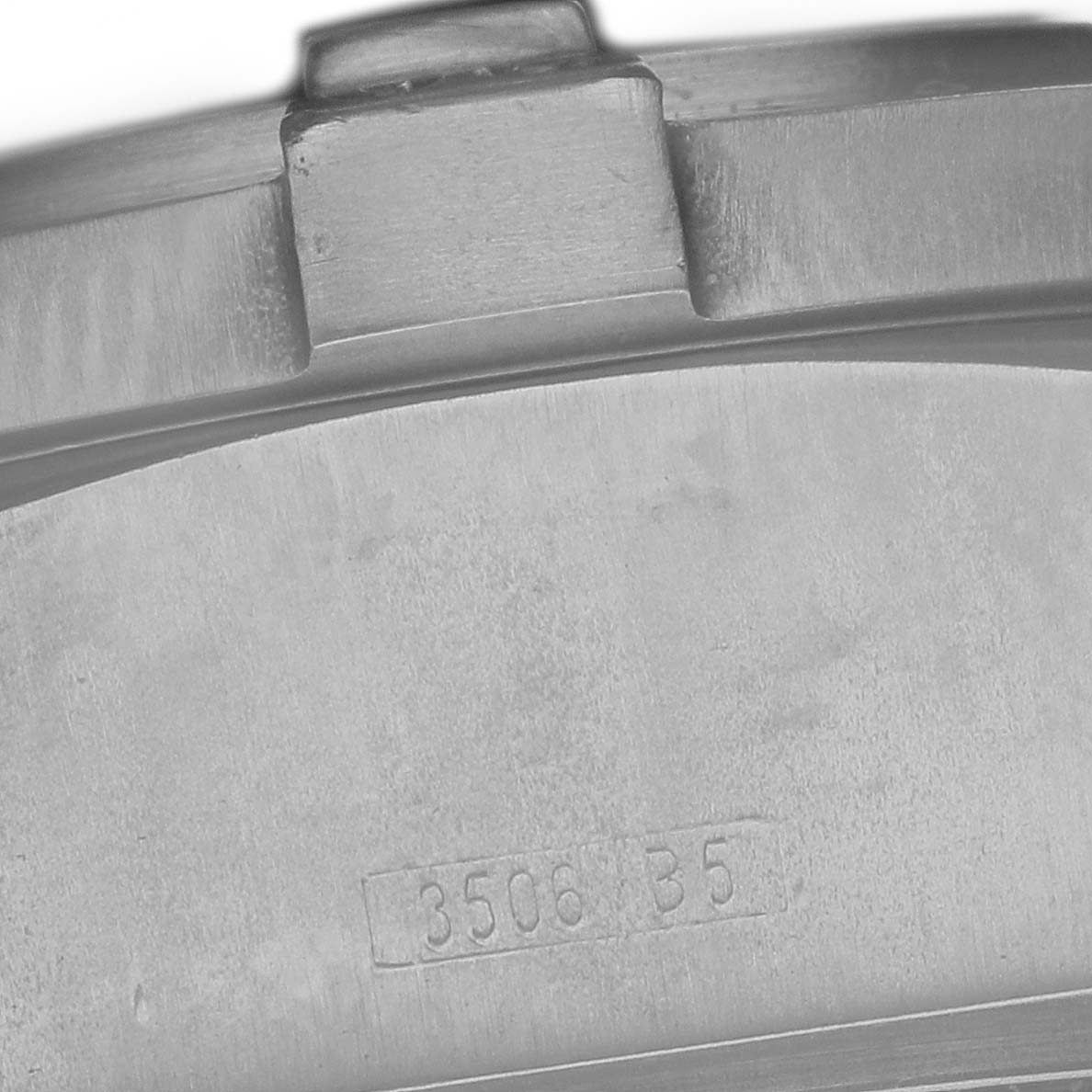 The image shows a close-up of the side case of the Breitling Avenger E17370 Men
s Titanium Yellow Dial watch, highlighting the crown and serial number.