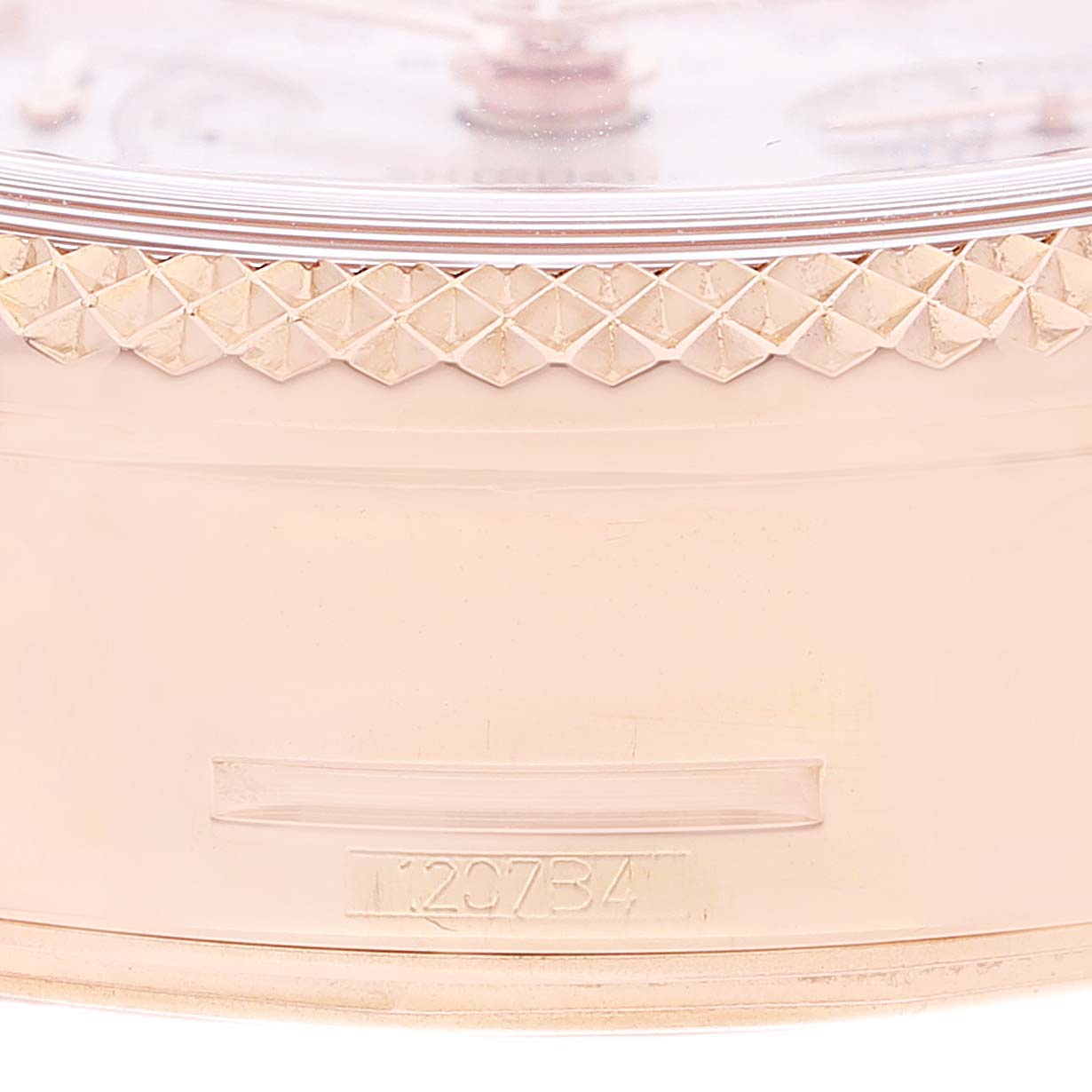 Close-up shot of the Breitling Bentley R26362 Men's Rose Gold Mother of Pearl Dial R26362 Men's Rose Gold Mother of Pearl Dial model watch bezel and case with a partial serial number visible.