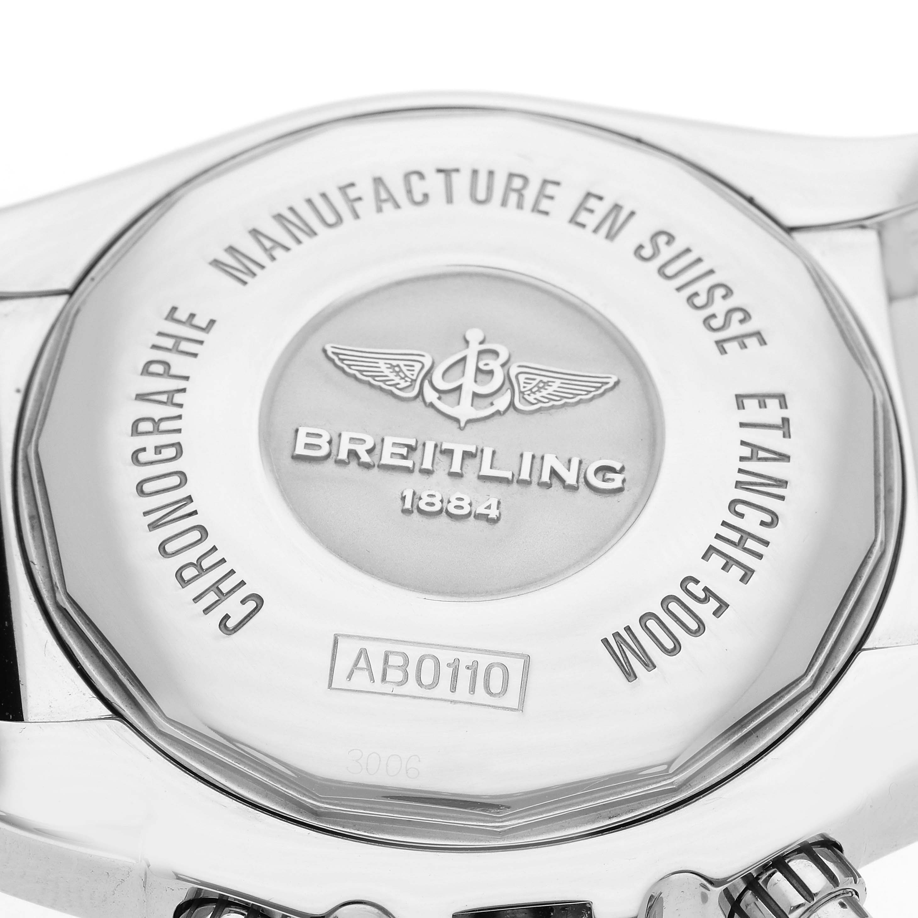 The image shows the back of a Breitling Chronomat AB0110 Men
s Stainless Steel Black Dial watch with engraved branding and model information.