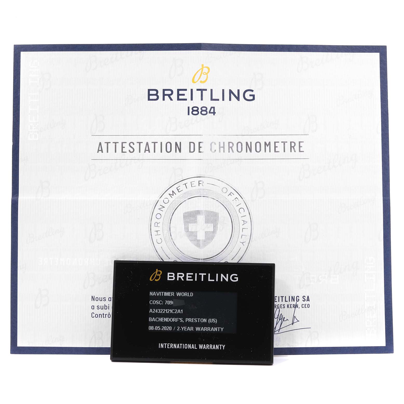 The image displays the Breitling Navitimer A24322 Men's Stainless Steel Blue Dial A24322 Men's Stainless Steel Blue Dial model's certificate and international warranty card from a front angle.