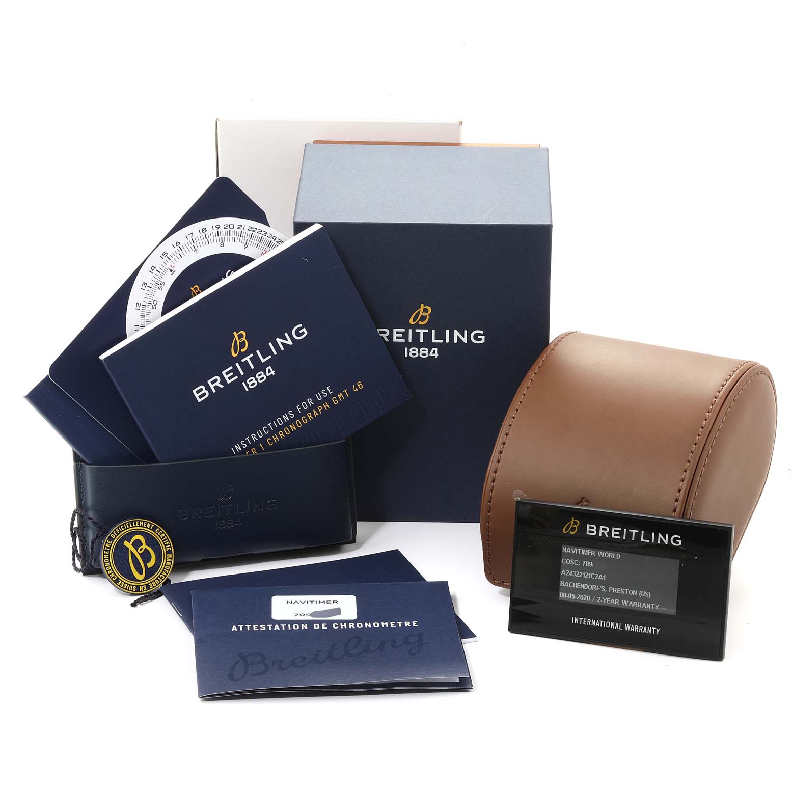 The image shows the packaging, manuals, warranty card, and a brown leather case for a Breitling Navitimer A24322 Men's Stainless Steel Blue Dial A24322 Men's Stainless Steel Blue Dial model watch.