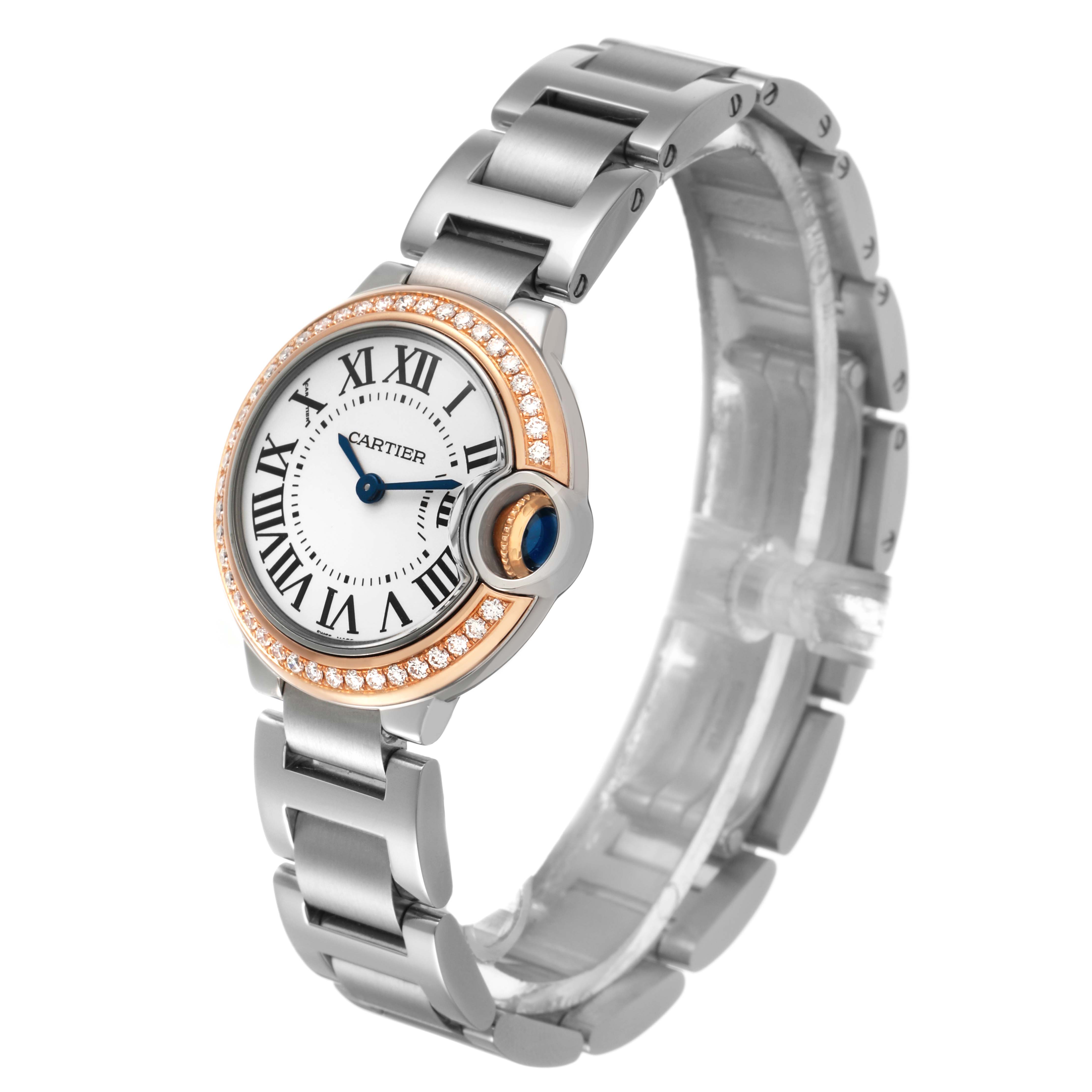 The Cartier Ballon Bleu WE902079 Women's Steel and Gold (two tone) Silver Dial watch is shown at a slight angle, displaying the face, Roman numerals, bracelet, and diamond-encrusted bezel.
