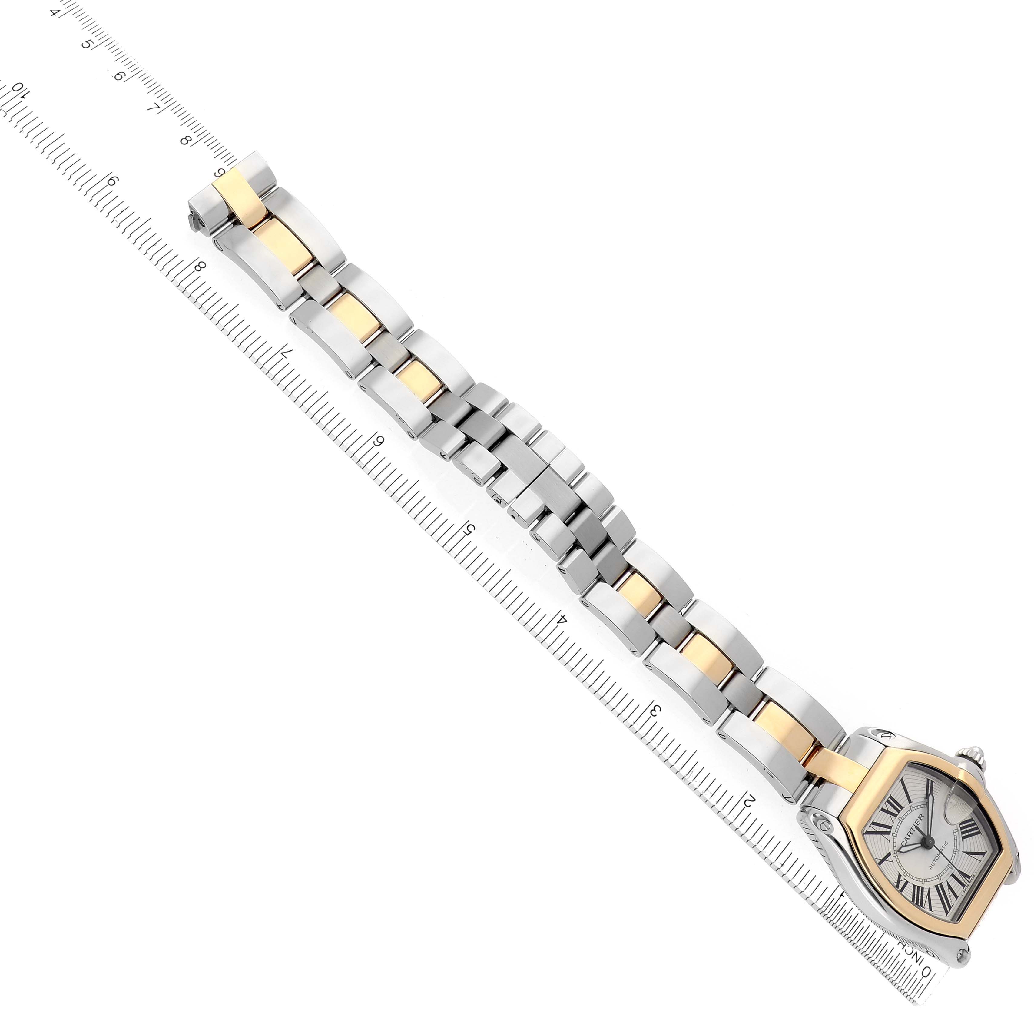 The Cartier Roadster W62031Y4 Men
s Steel and Gold (two tone) Silver Dial watch is displayed diagonally, showcasing the face, bezel, and two-tone bracelet.