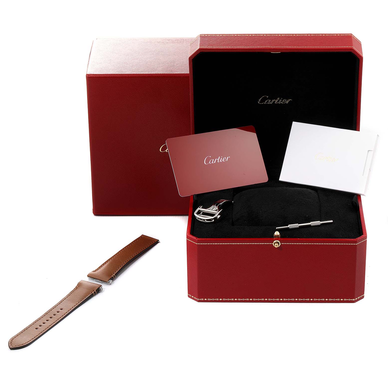 This image shows the accessories for the Santos model by Cartier, including a watch strap, a red box, booklets, and a tool.