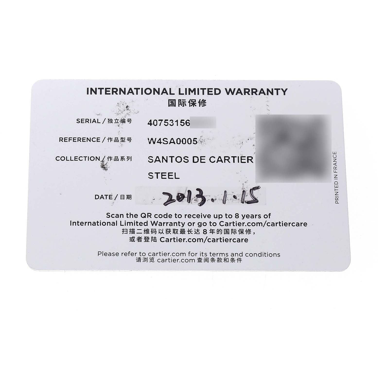 This image shows an International Limited Warranty card for the Santos de Cartier watch model.