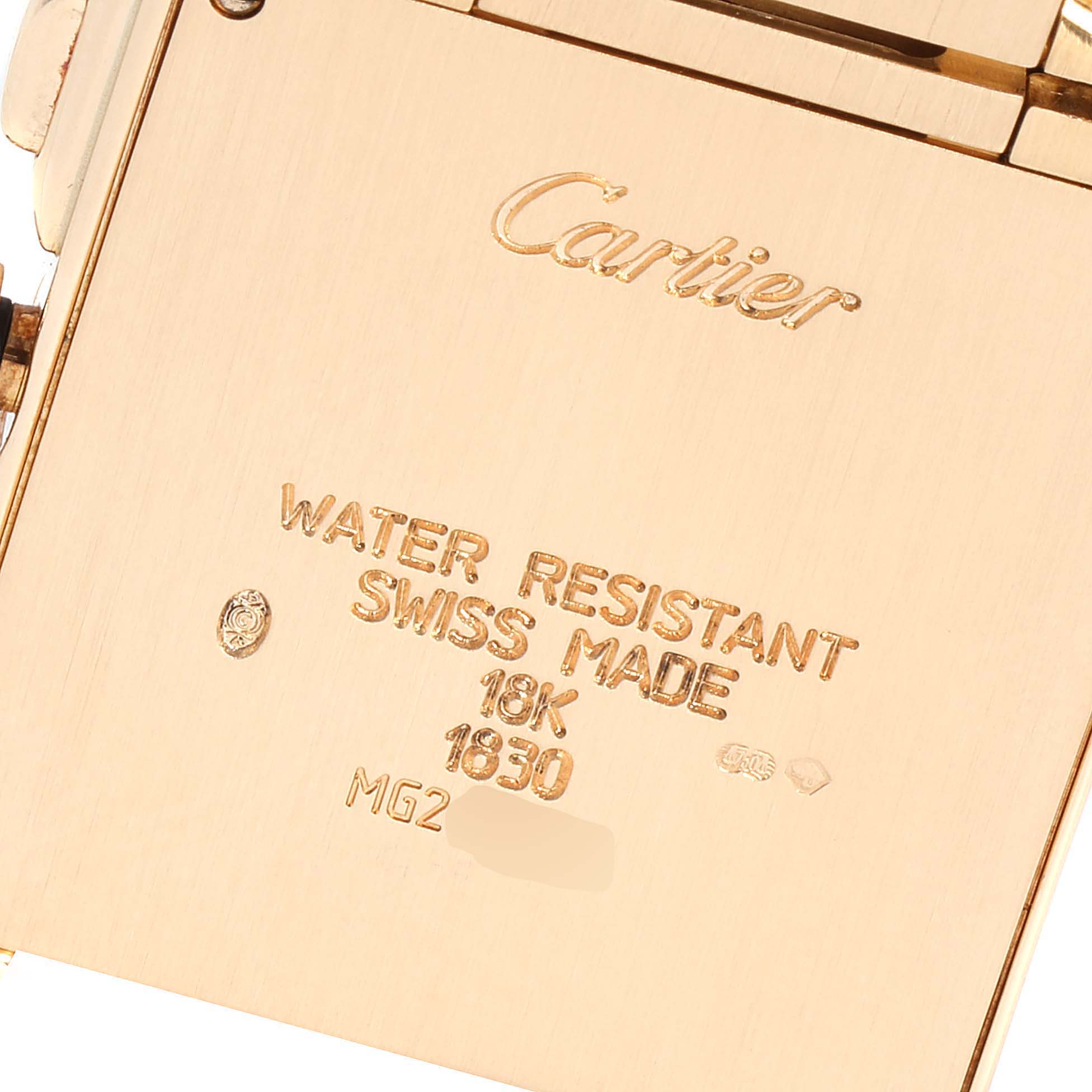This image shows the back of a Cartier Tank Française watch, highlighting its engravings and water resistance information.