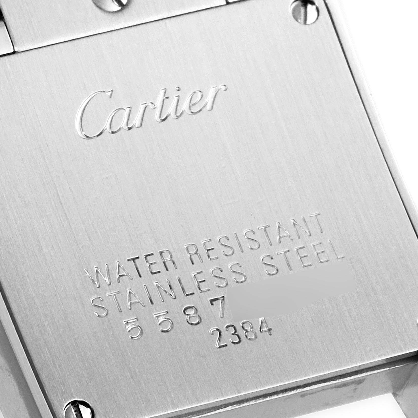 The image shows the back casing of a Cartier Tank Francaise W51028Q3 Women
s Stainless Steel Mother of Pearl Dial W51028Q3 Women
s Stainless Steel Mother of Pearl Dial watch, highlighting its stainless steel material and water resistance.