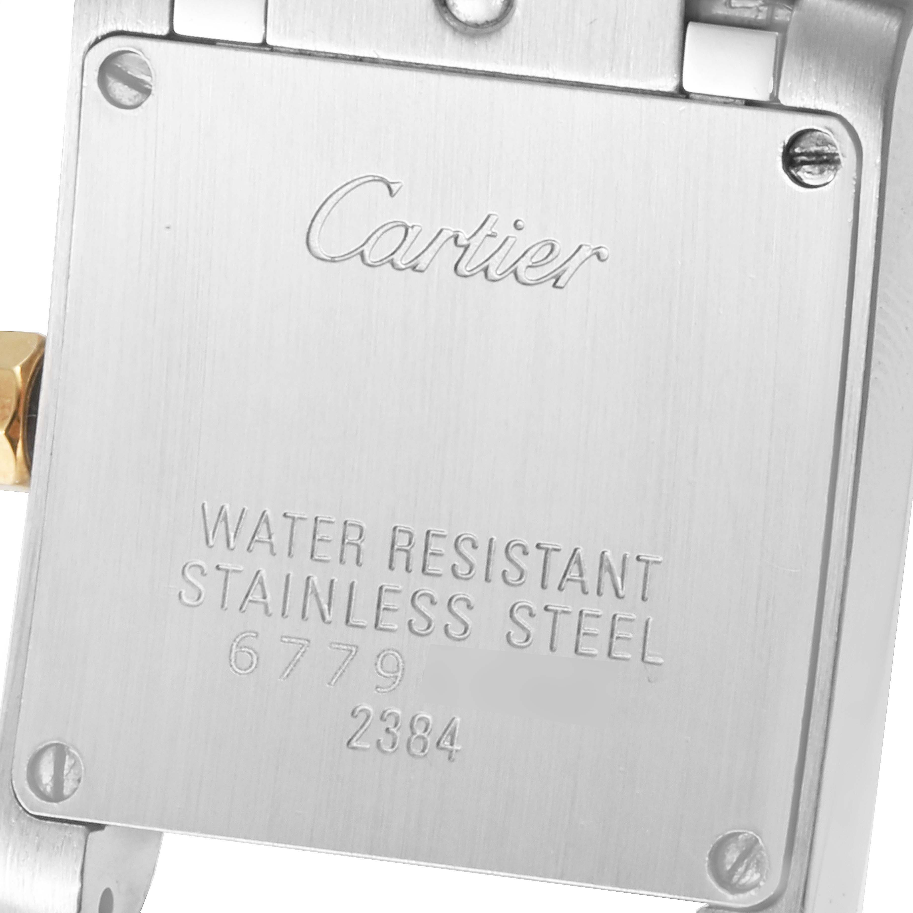 The image shows the stainless steel case back of a Cartier Tank Française watch with engraved text.