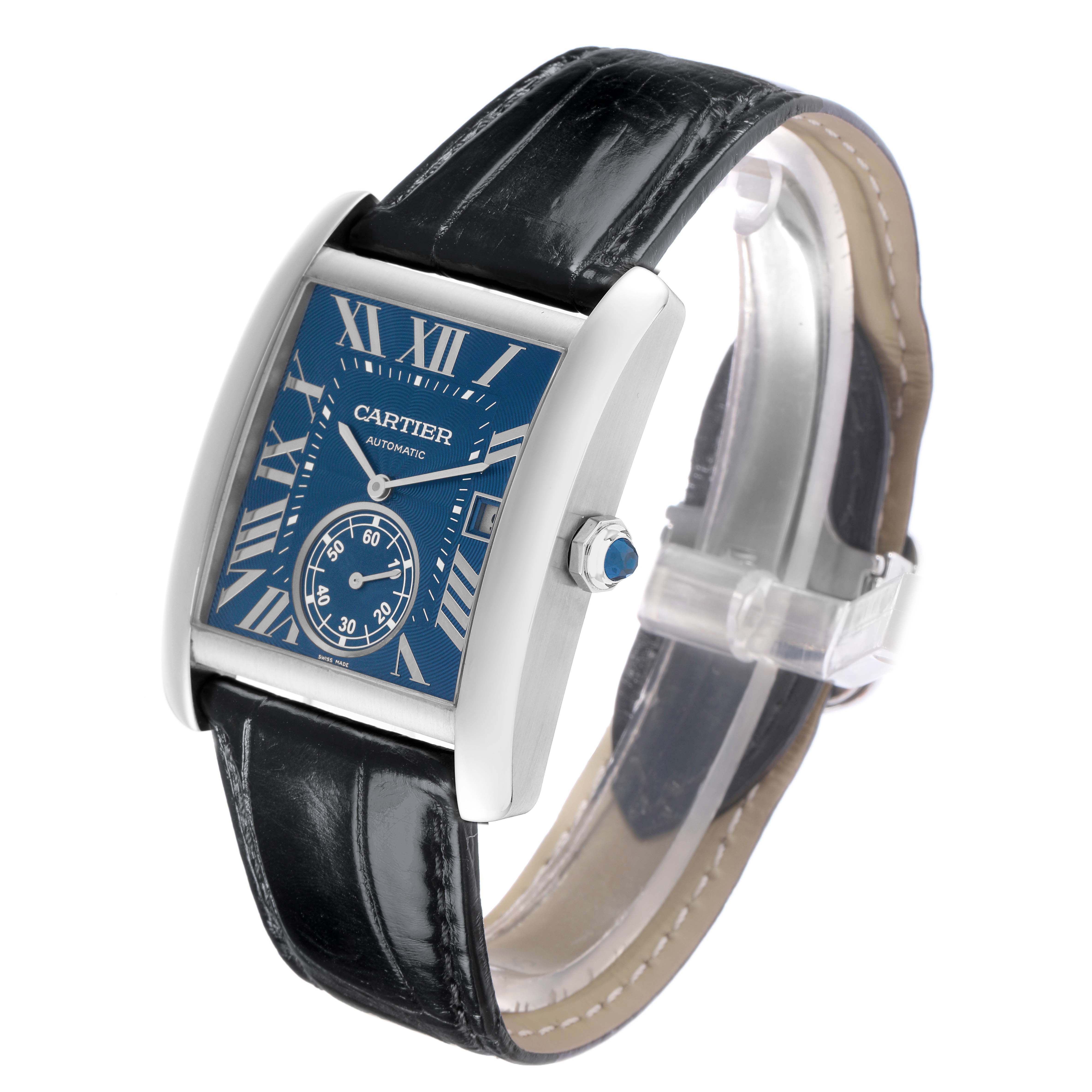 The image shows a Cartier Tank MC WSTA0010 Men
s Stainless Steel Blue Dial watch at a three-quarter angle, highlighting the blue dial, roman numerals, case, crown, and leather strap.