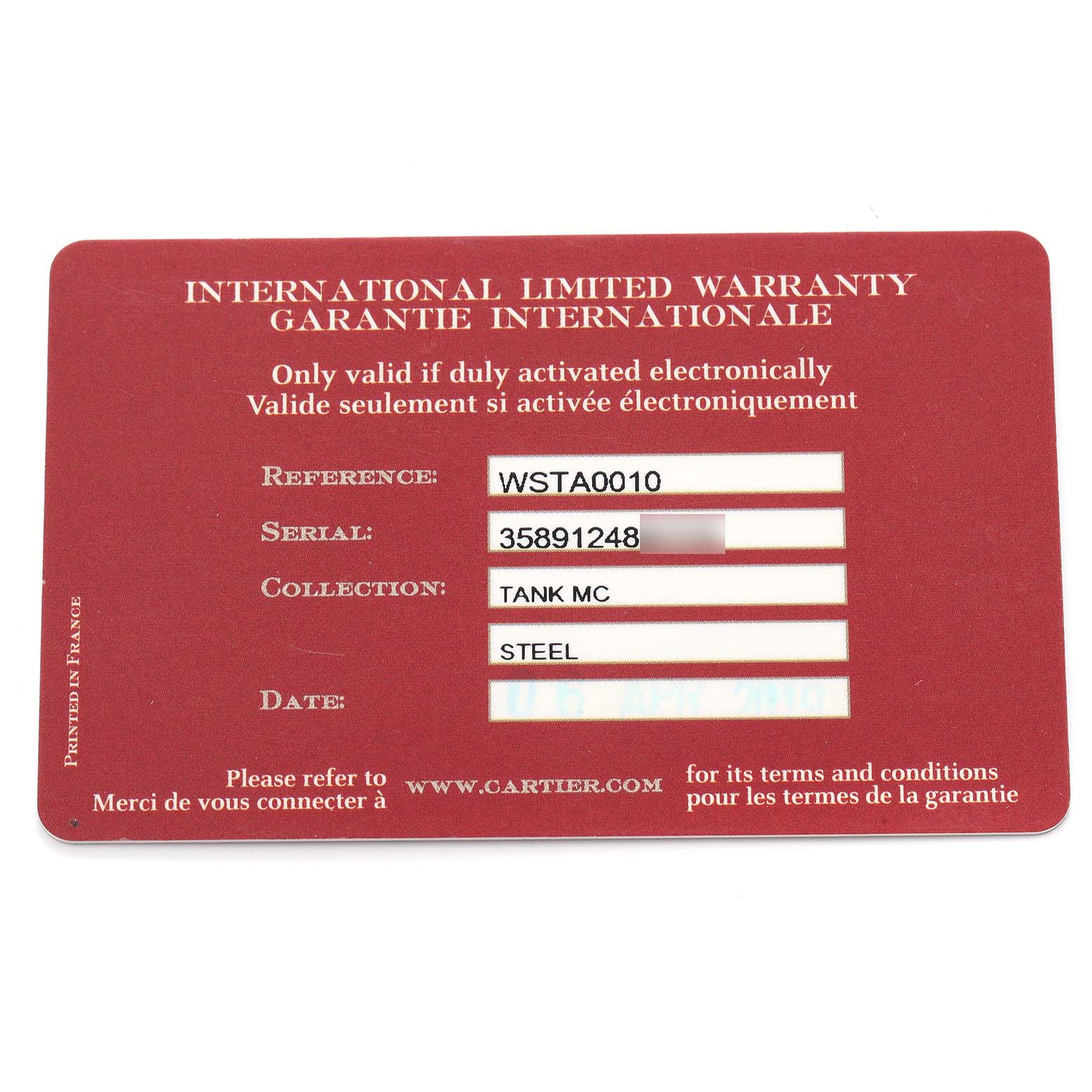 The image shows the Cartier Tank MC WSTA0010 Men
s Stainless Steel Blue Dial warranty card with reference and serial information.