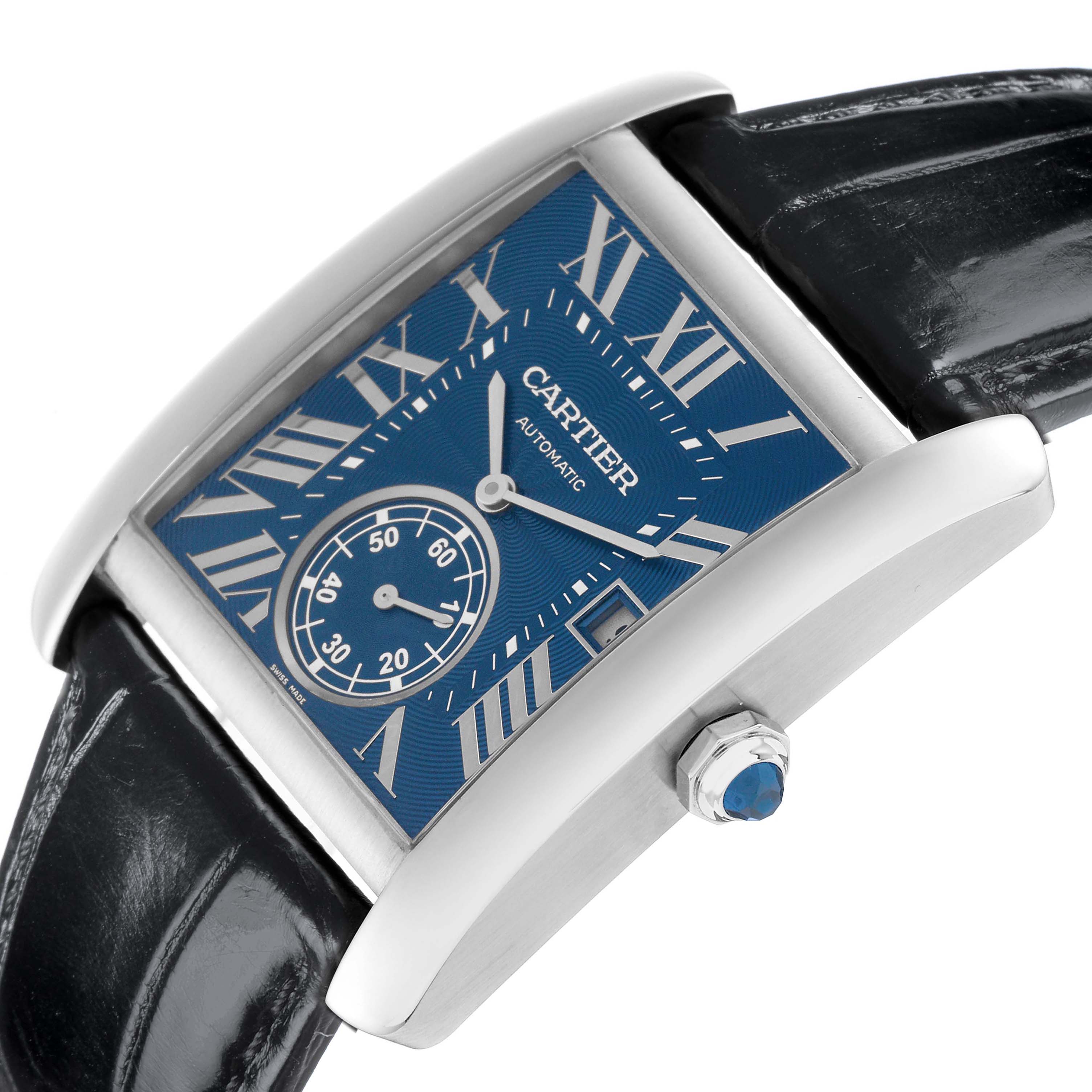 The Cartier Tank MC WSTA0010 Men
s Stainless Steel Blue Dial watch is shown at an angled view, highlighting the blue dial, Roman numerals, and crown with a blue cabochon.