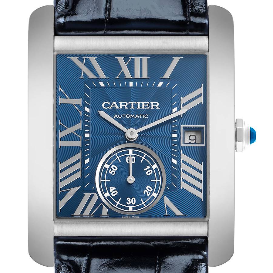 The Cartier Tank MC model WSTA0010 watch is shown from the front angle, highlighting the blue dial, Roman numerals, subdial, and crown with a blue cabochon.