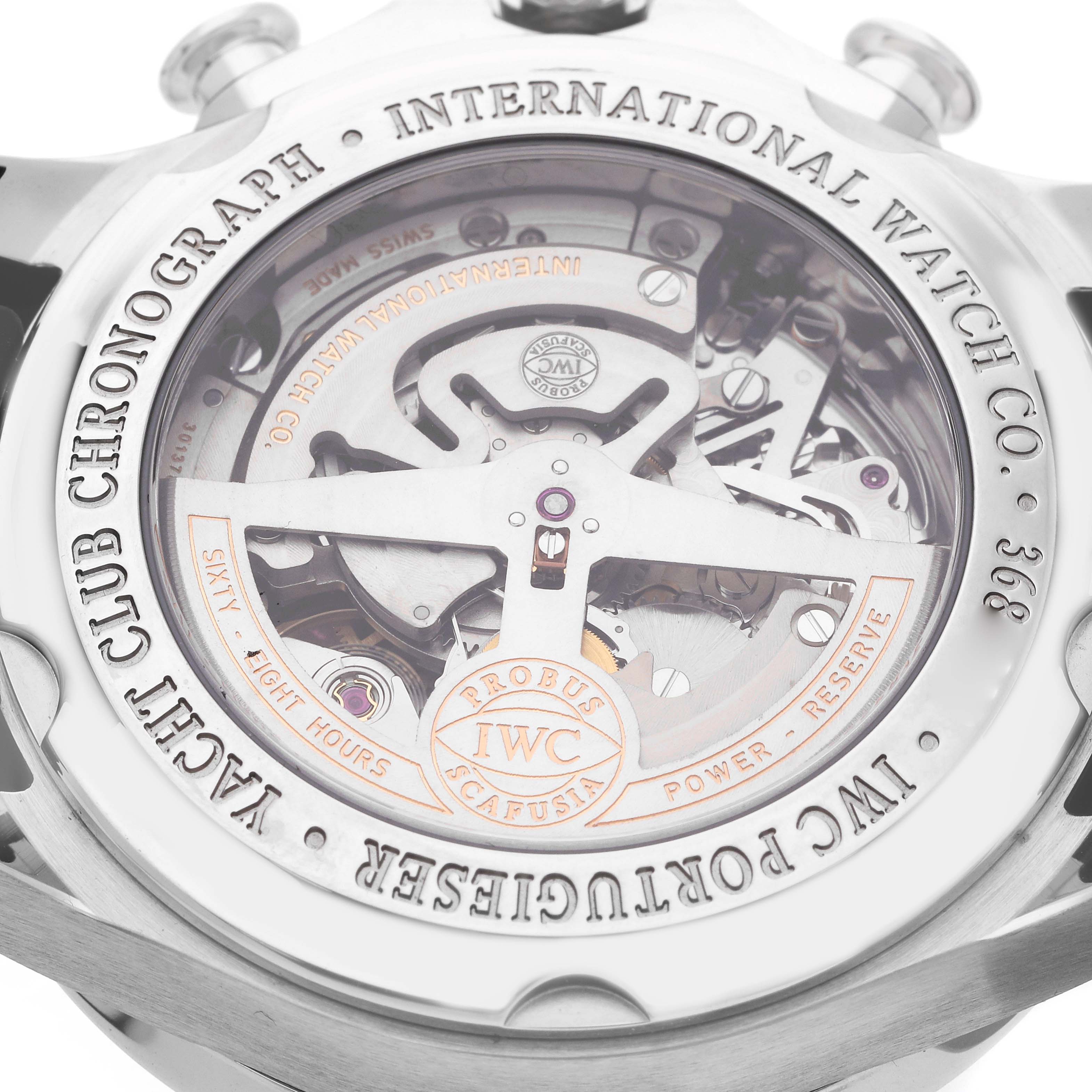 The image shows the back of the IWC Portuguese IW390212 Men
s Titanium Black Dial watch, highlighting its intricate mechanical movement and engravings.