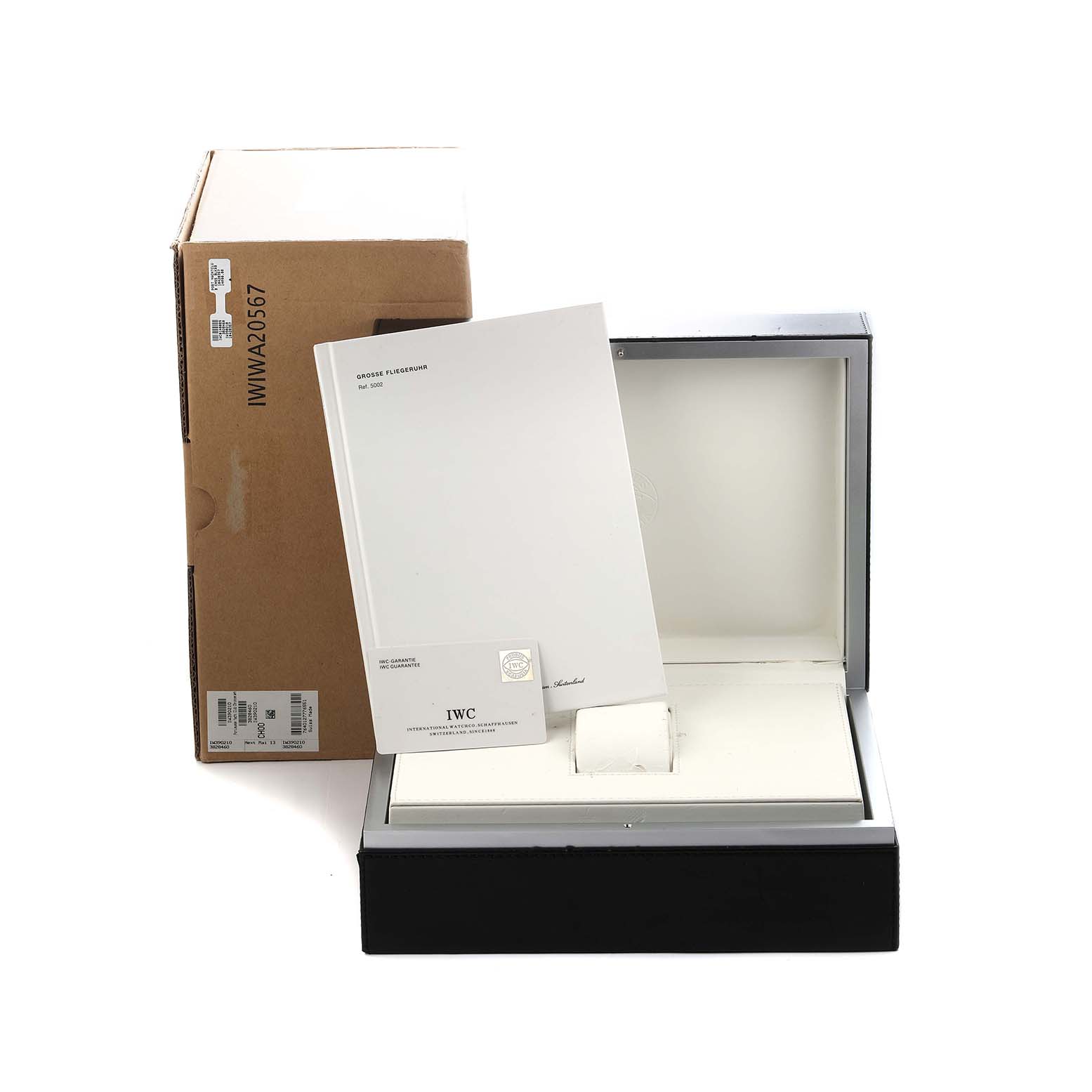 The image shows the packaging and documentation for an IWC Portuguese IW390212 Men
s Titanium Black Dial model, including the box, manual, and warranty card.