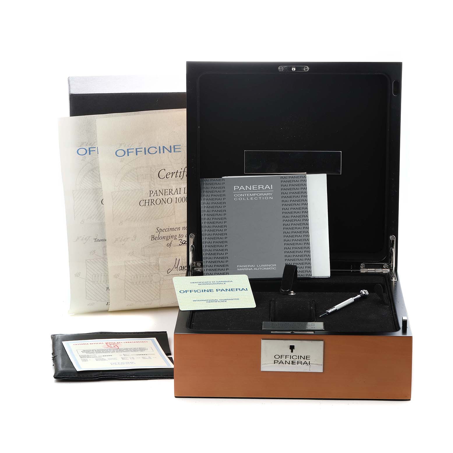 The image shows packaging and accessories for a Panerai Submersible PAM00225 Men
s Titanium White Dial, including its box, certificate, and manuals.