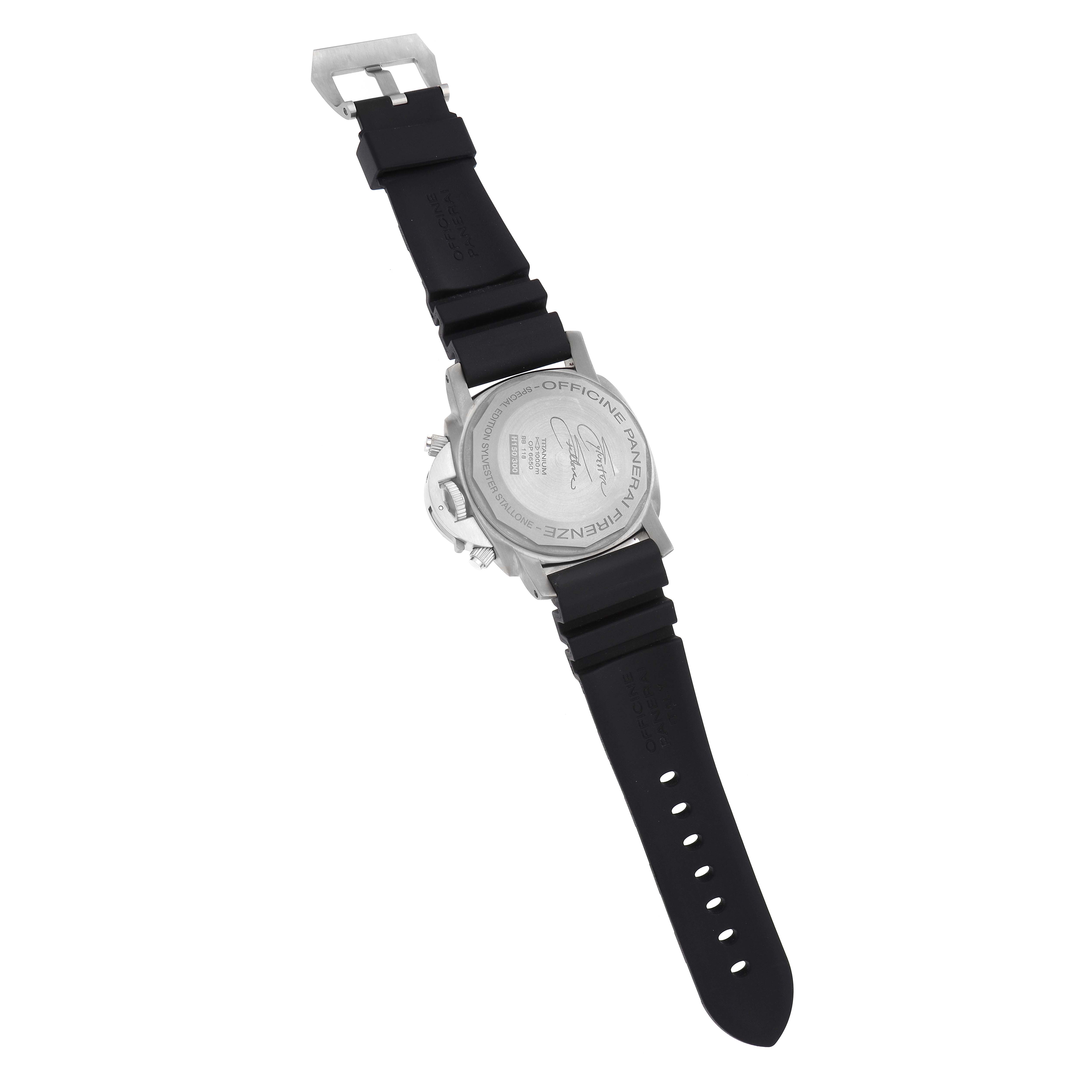 The Panerai Submersible PAM00225 Men
s Titanium White Dial is shown at an angle highlighting the back case, crown, black strap, and buckle.