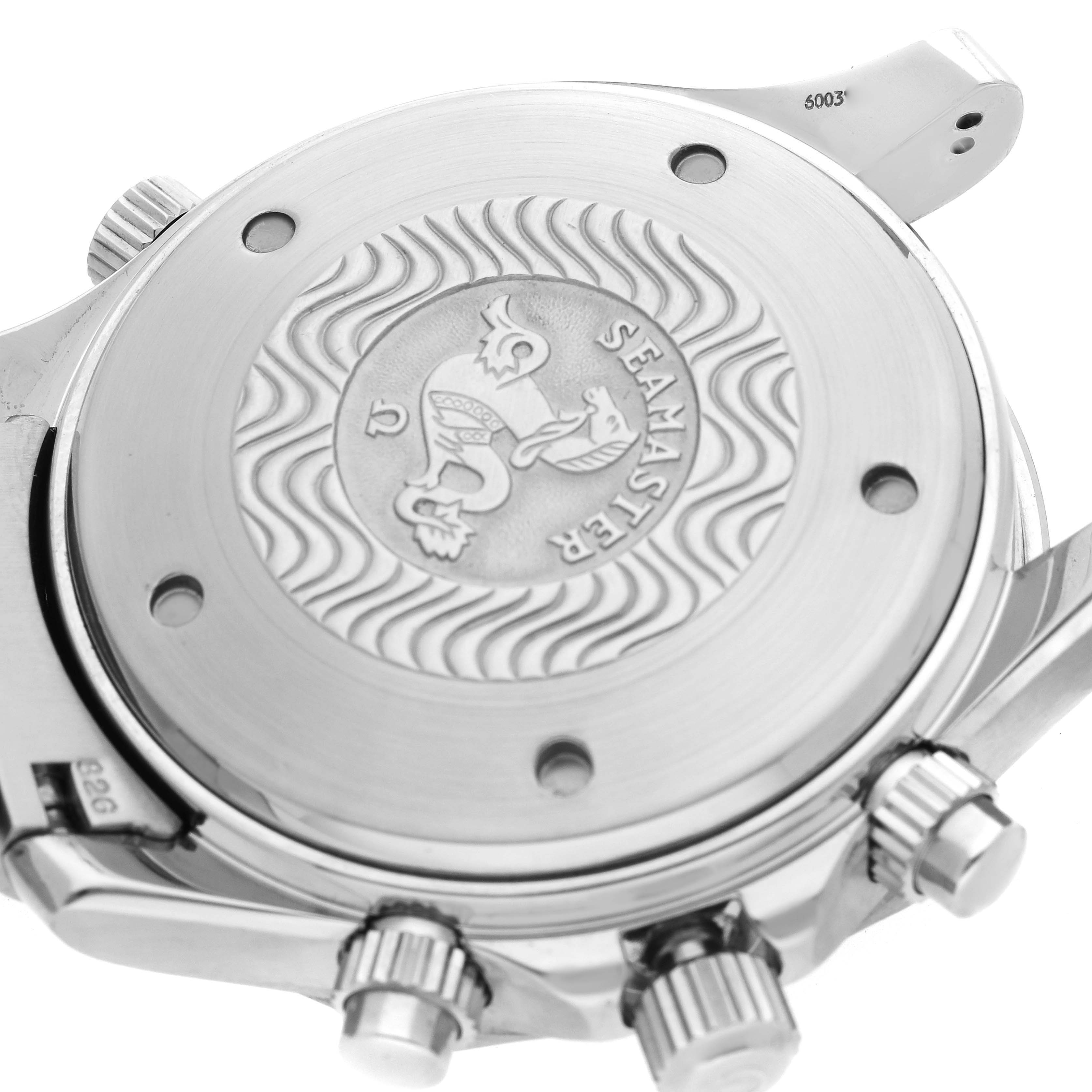 The image shows the back case of an Omega Seamaster 2599.80.00 Men
s Stainless Steel Blue Dial watch, highlighting the engravings and crown elements.