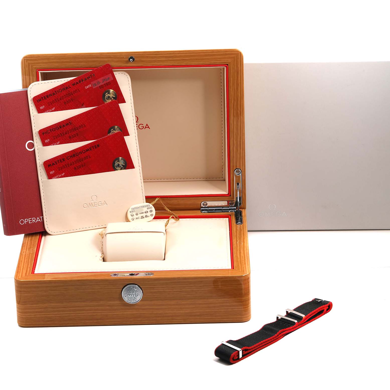 The image shows an Omega Seamaster 210.32.42.20.01.001 Men's Stainless Steel Black Dial model with its box, warranty cards, instruction manual, and an additional strap.