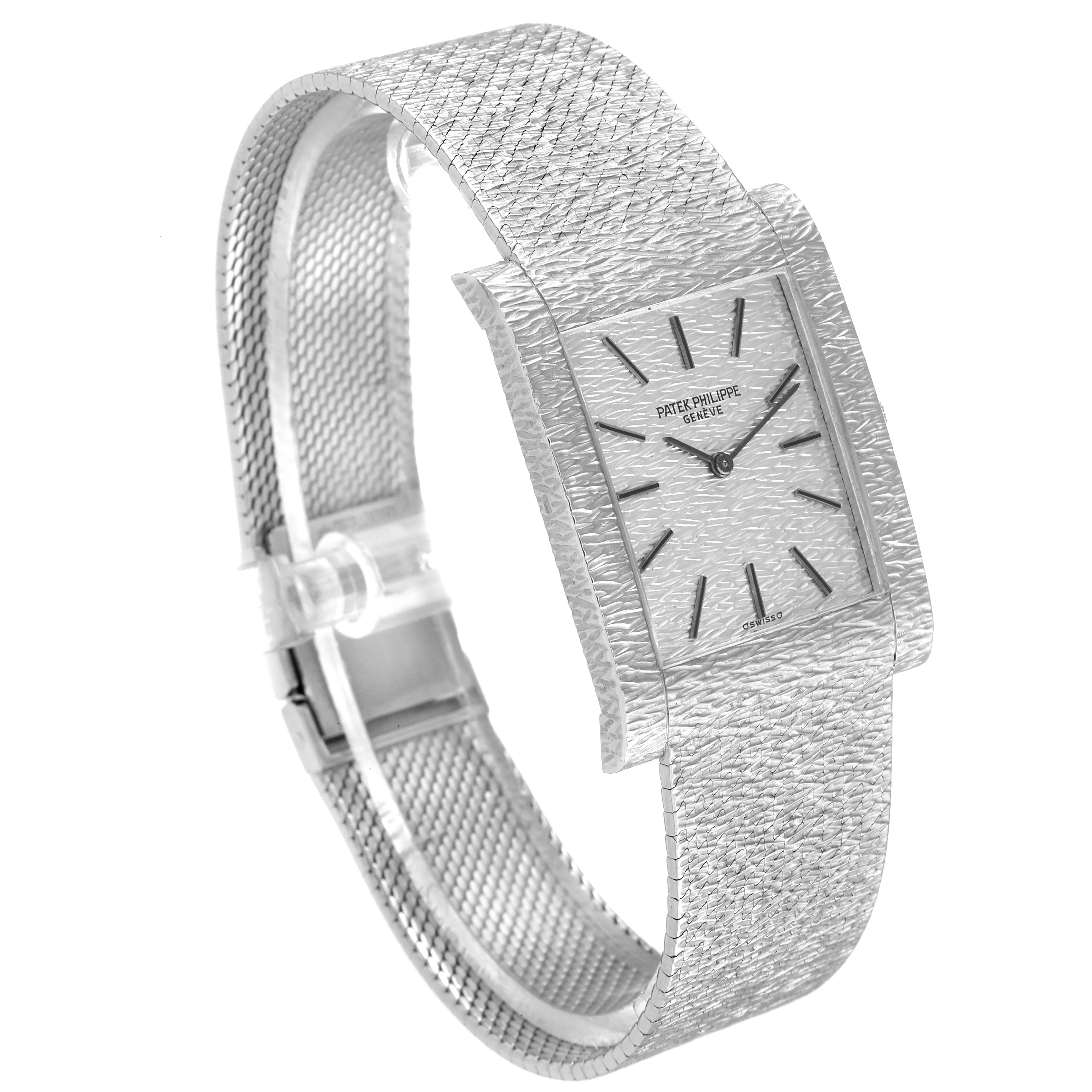 This image shows a side angle of a Vintage Patek Philippe watch, highlighting its rectangular case and textured bracelet.