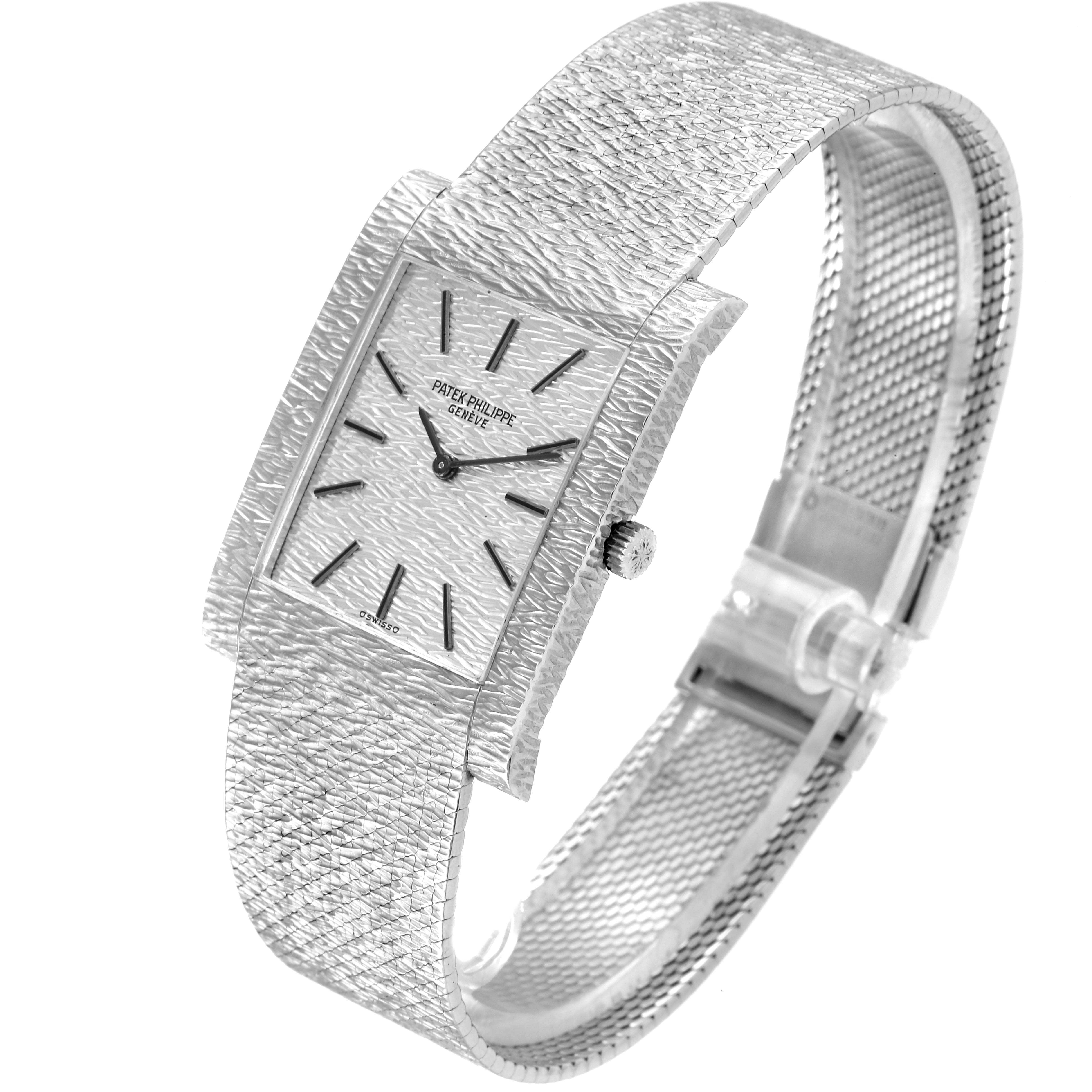 This image shows a side angle of the Vintage Patek Philippe watch, highlighting its rectangular dial, textured face, and metal bracelet.