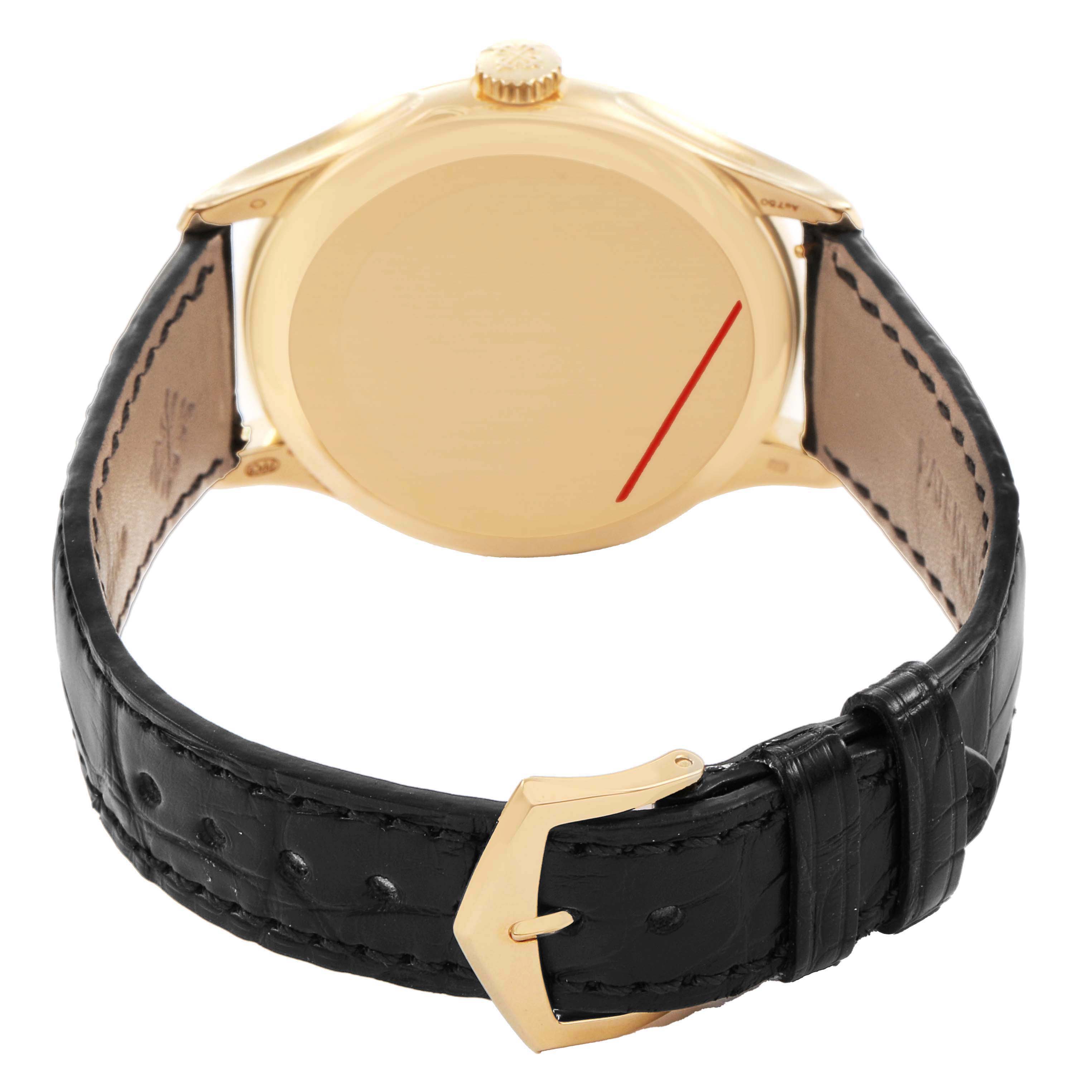 The image shows the back view of a Patek Philippe Calatrava 5227J Men's Yellow Gold White Dial watch, highlighting the case, strap, and buckle.