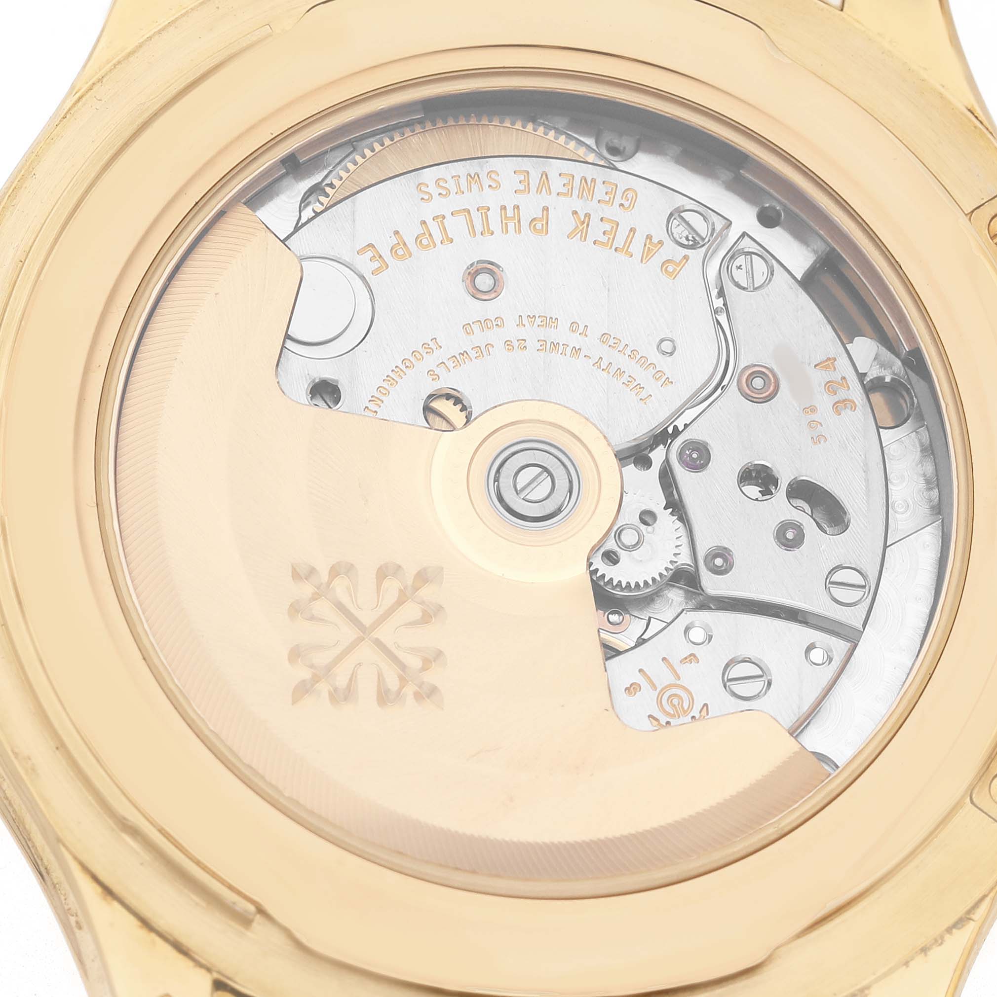The image shows the case back of the Patek Philippe Calatrava 5227J Men's Yellow Gold White Dial, highlighting its intricate movement.