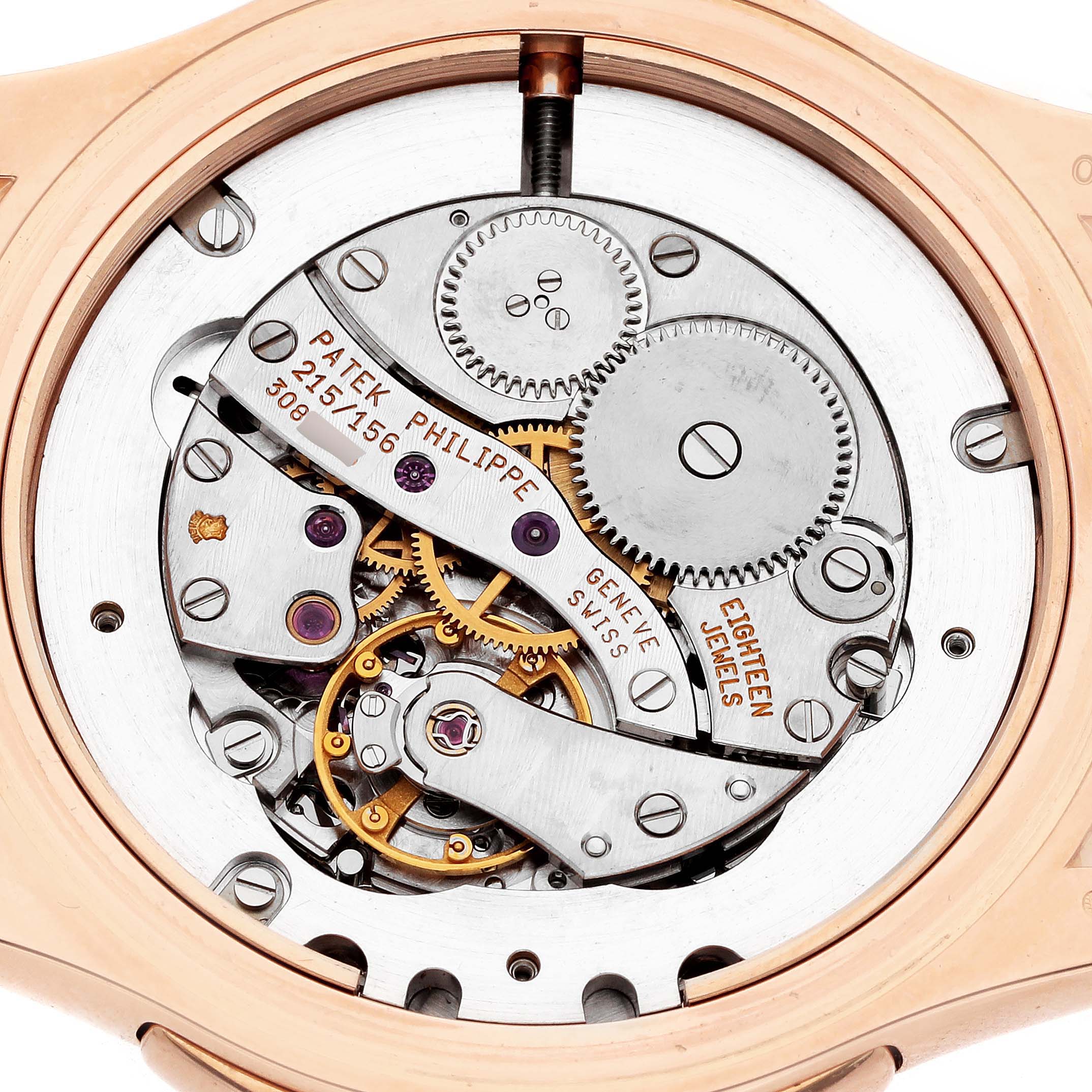The image shows the back view of a Patek Philippe Calatrava 5134R Men
s Rose Gold White Dial, highlighting the intricate mechanics and movement details.