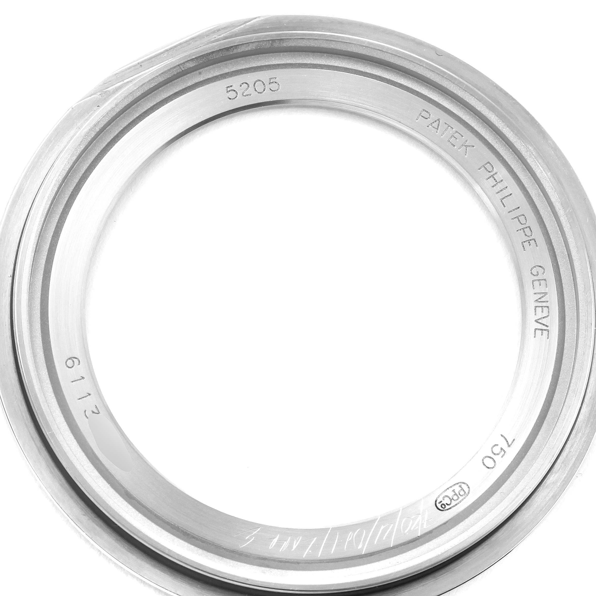 This image shows the bezel of a Patek Philippe Complications 5205G - 010 Men's White Gold Grey Dial 5205G - 010 Men's White Gold Grey Dial model 5205 from a top-down angle.