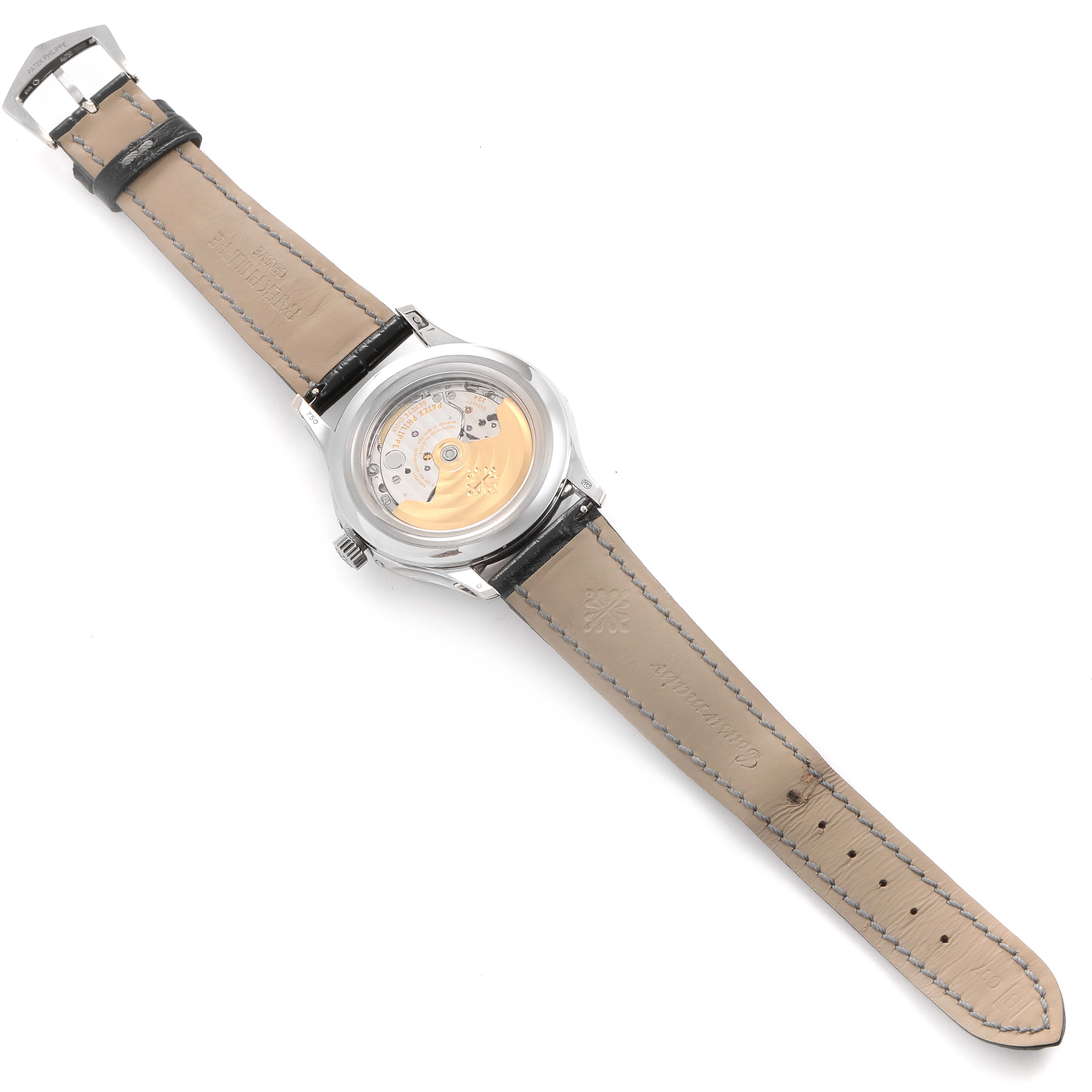 The image shows the back view of the Patek Philippe Complications 5205G - 010 Men's White Gold Grey Dial 5205G - 010 Men's White Gold Grey Dial model watch, highlighting the movement and the leather strap.