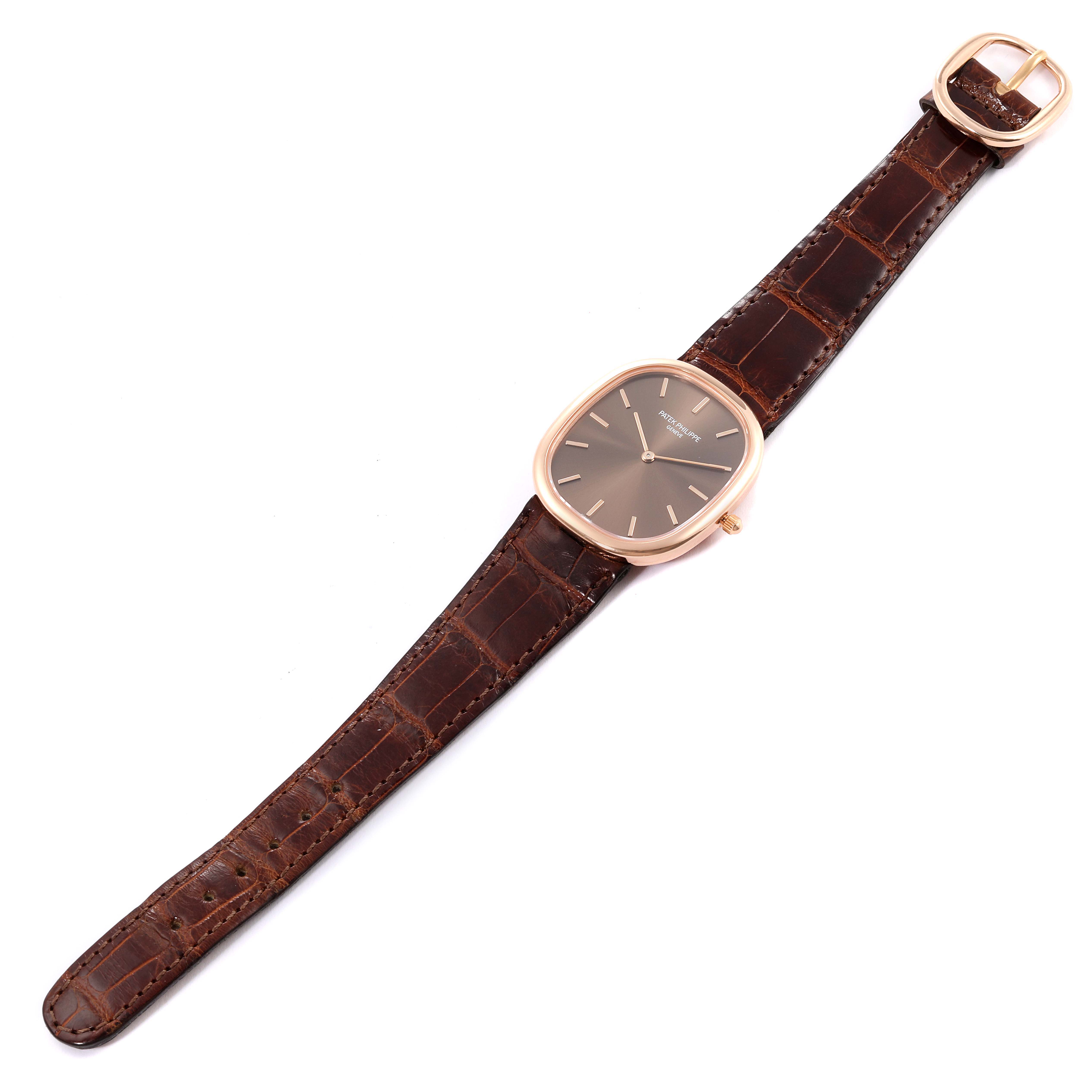The image shows a Patek Philippe Golden Ellipse 3738/100R-001 Men's Rose Gold Brown Dial 3738/100R-001 Men's Rose Gold Brown Dial watch with a brown leather strap, viewed from above.