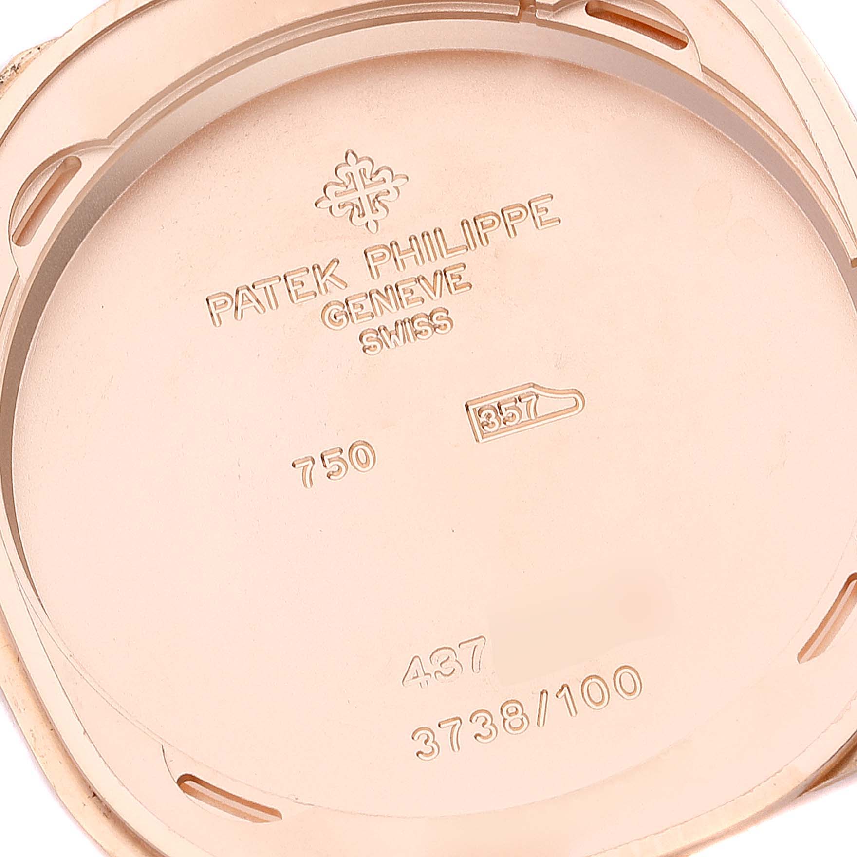 This image shows the inside case back of the Patek Philippe Golden Ellipse 3738/100R-001 Men's Rose Gold Brown Dial 3738/100R-001 Men's Rose Gold Brown Dial watch, featuring inscriptions and hallmarks.