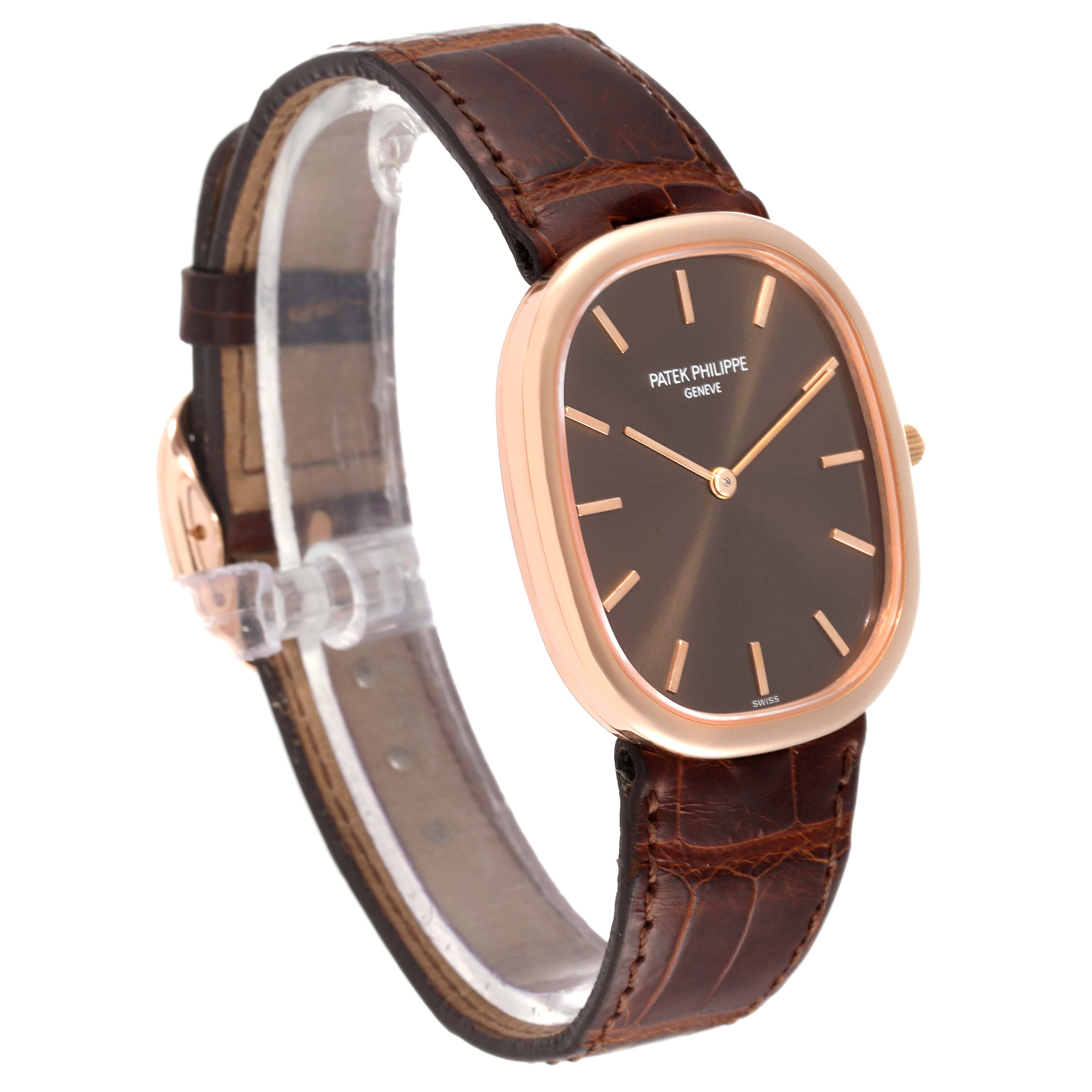 The image shows a Patek Philippe Golden Ellipse 3738/100R-001 Men's Rose Gold Brown Dial 3738/100R-001 Men's Rose Gold Brown Dial model watch from a front-side angle, highlighting its brown strap, golden case, and dark dial.