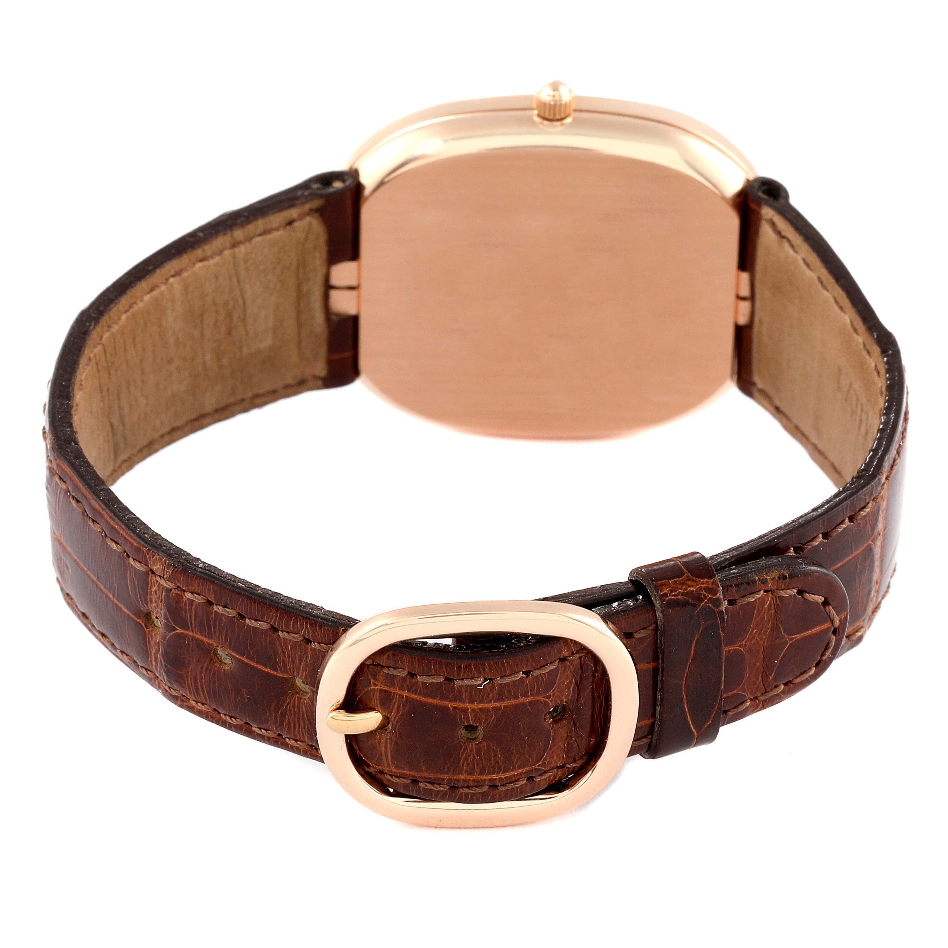 The image shows the back view of a Patek Philippe Golden Ellipse 3738/100R-001 Men's Rose Gold Brown Dial 3738/100R-001 Men's Rose Gold Brown Dial watch, highlighting its gold back case and leather strap.