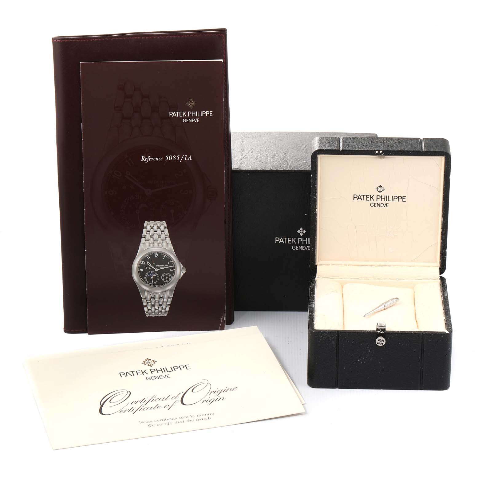 The image shows the packaging, manual, certificate, and box for the Patek Philippe Neptune 5085A/1A-001 Men's Stainless Steel Black Dial 5085A/1A-001 Men's Stainless Steel Black Dial model watch.