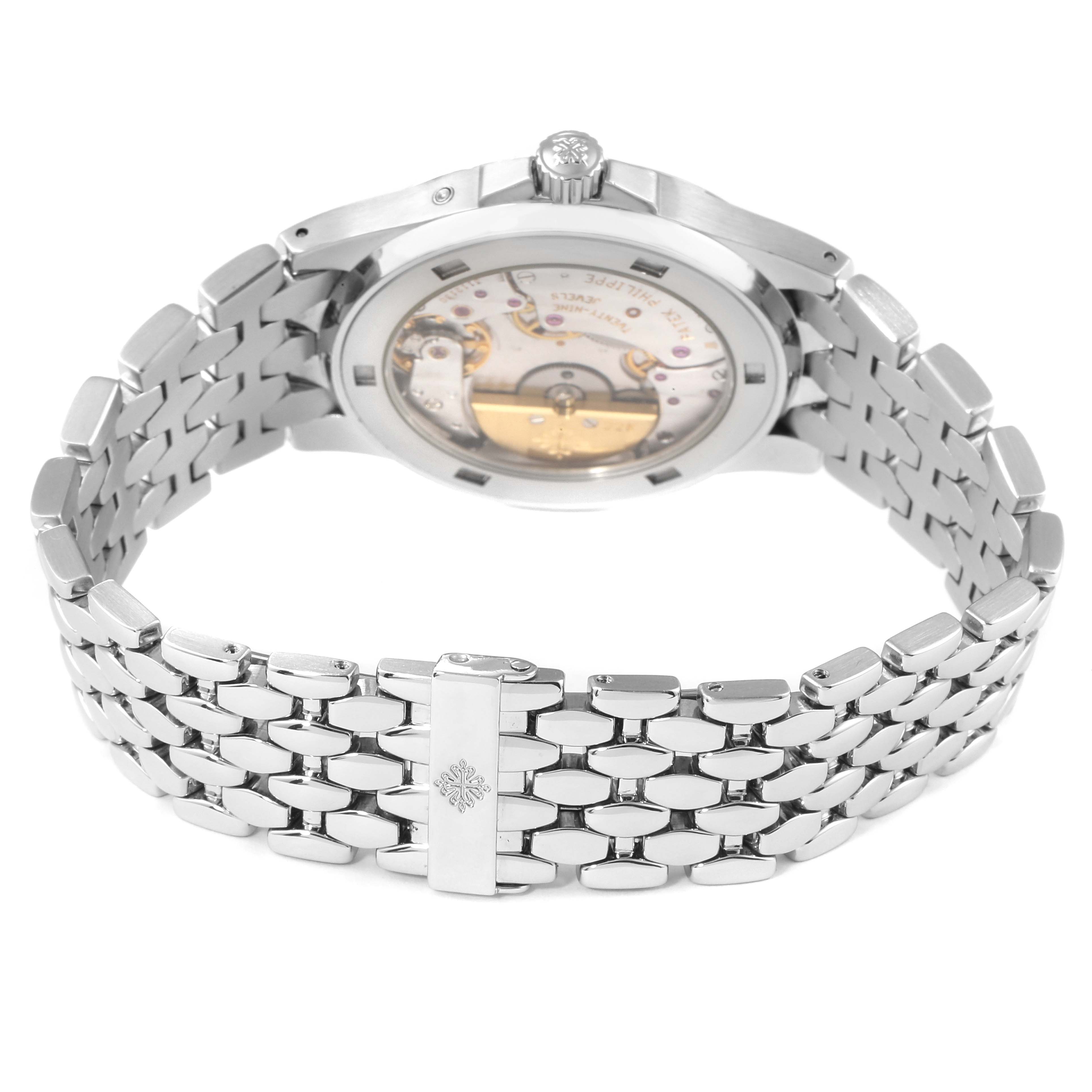 This image shows the back view of the Neptune model by Patek Philippe, highlighting its transparent case and metal bracelet.