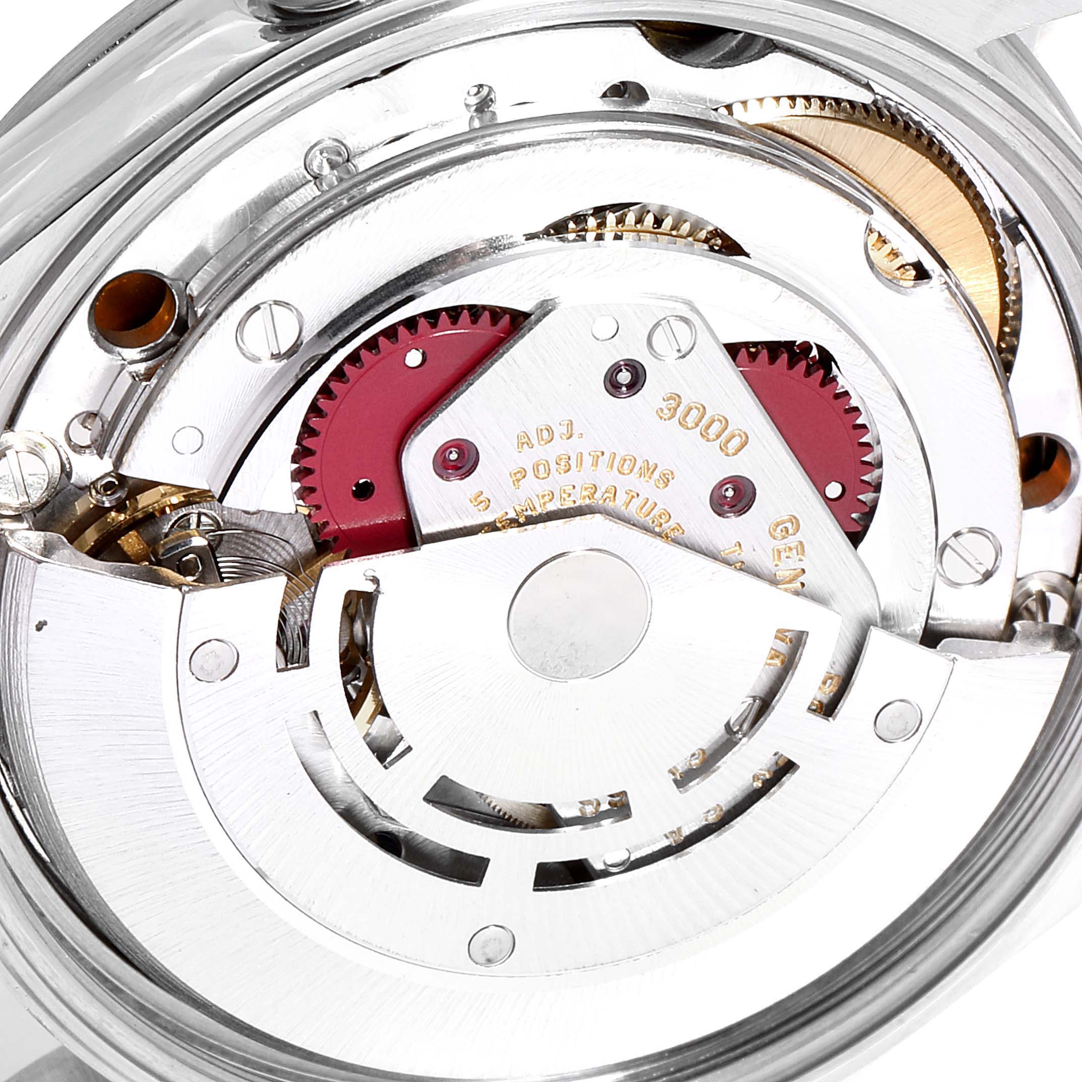 This image shows a close-up of the Rolex Air-King 14000M Men's Stainless Steel Blue Dial 14000M Men's Stainless Steel Blue Dial movement, showcasing gears and intricate watch parts.