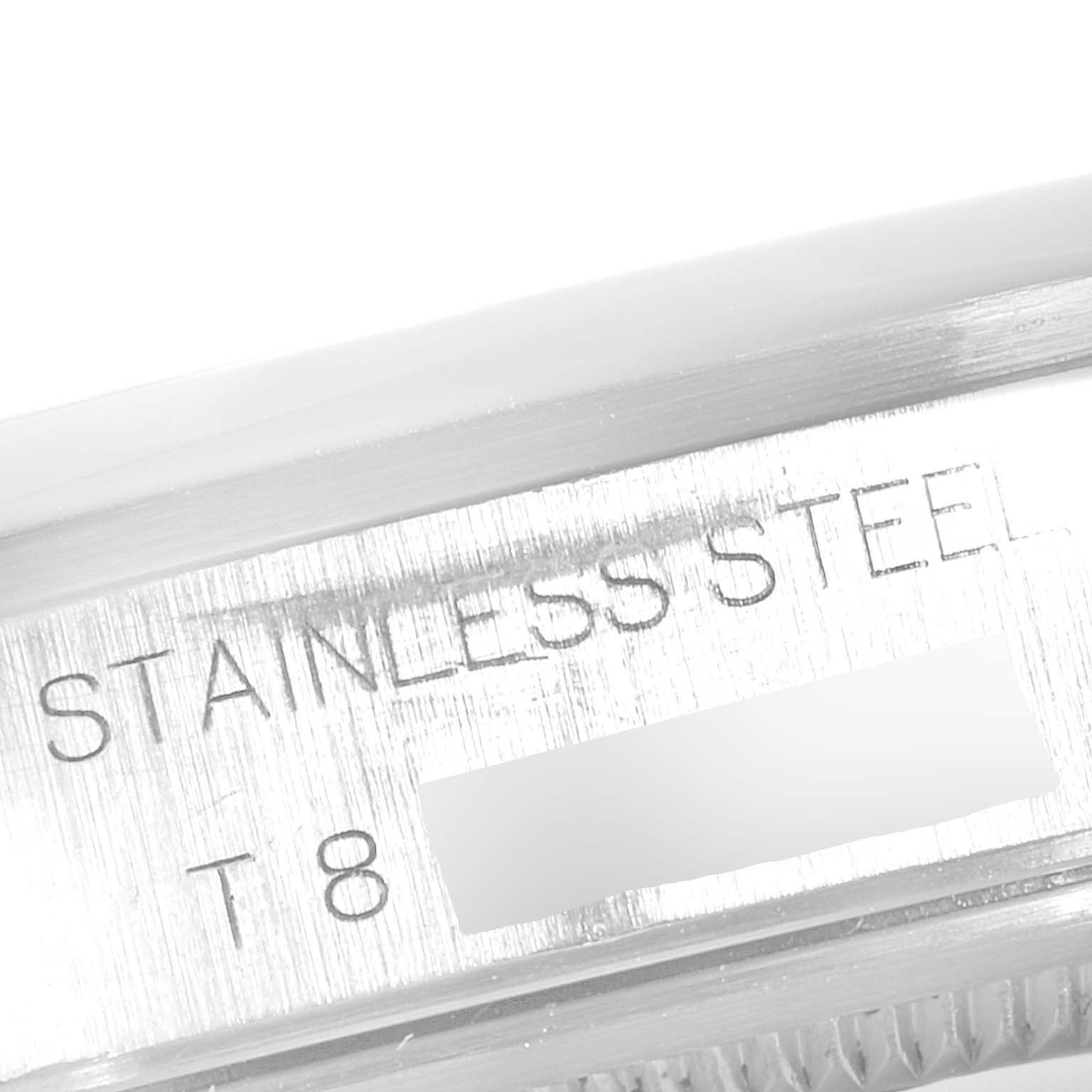 This close-up image shows the stainless steel case and part of the serial number engraving on the Rolex Air-King 14000M Men's Stainless Steel Blue Dial 14000M Men's Stainless Steel Blue Dial watch.