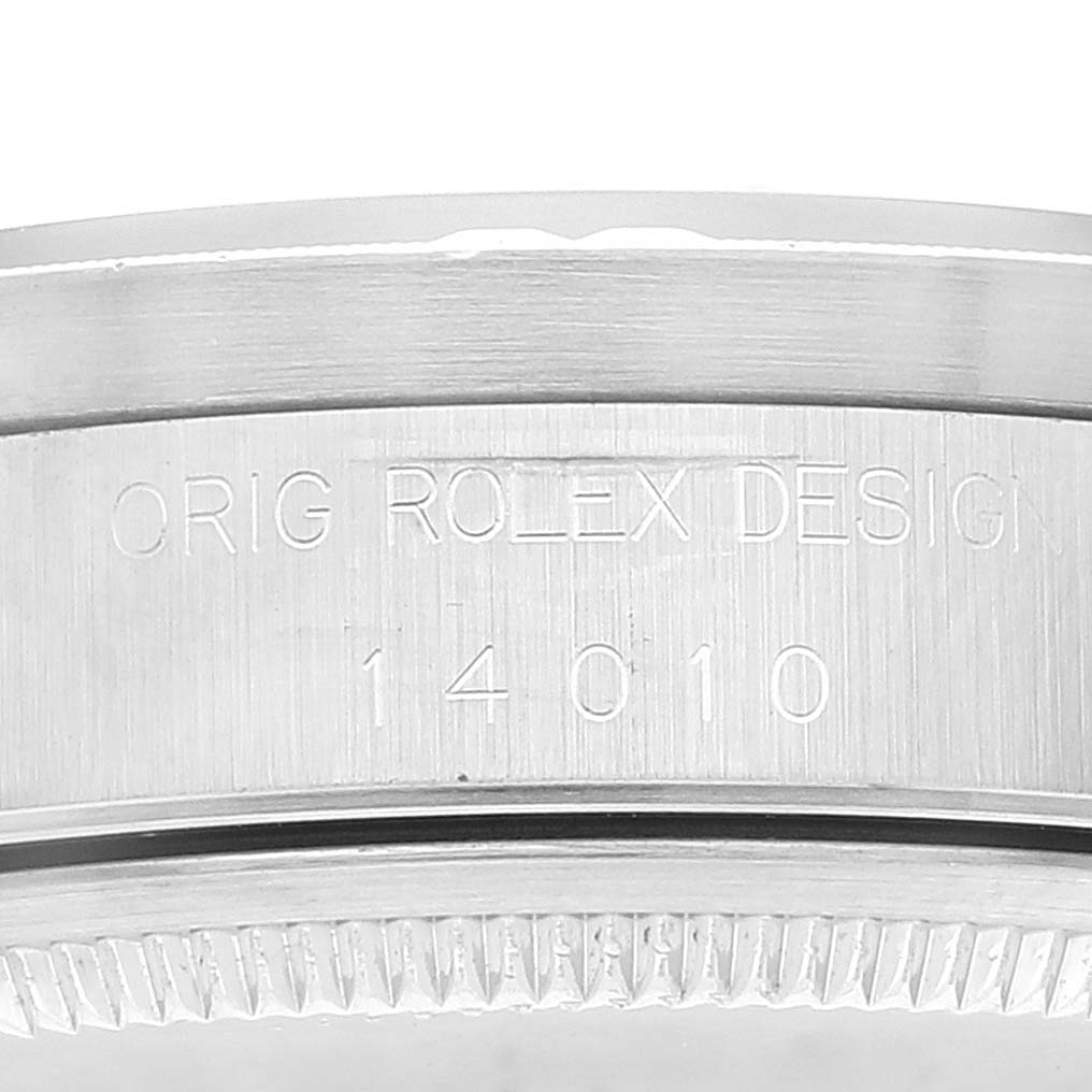 This image shows a close-up angle of the Rolex Air-King 14010 Men's Stainless Steel Blue Dial 14010 Men's Stainless Steel Blue Dial watch case, highlighting the engraved text and serial number.