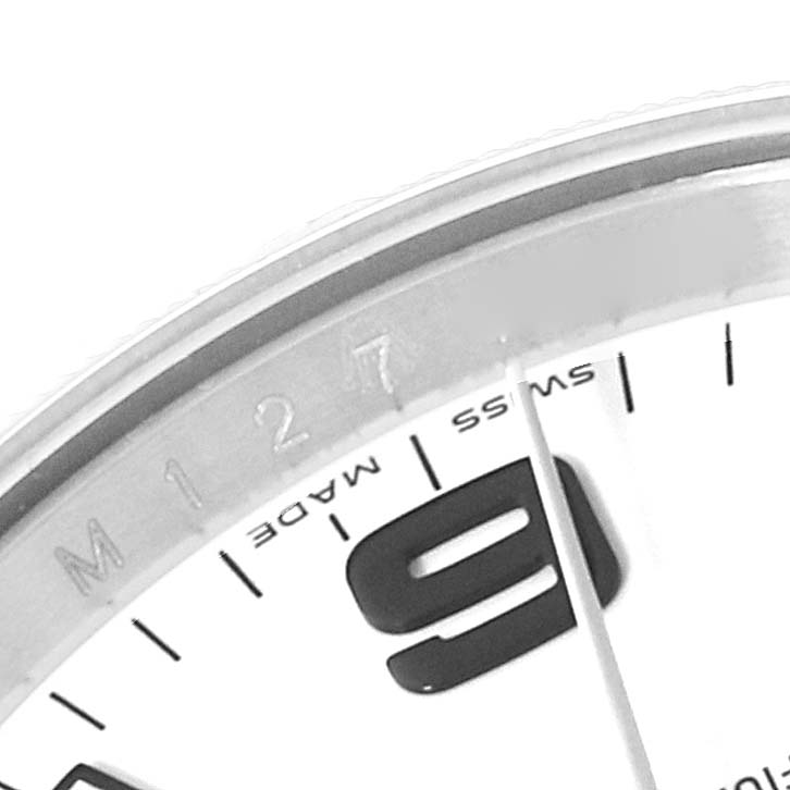 The image shows a close-up of the Rolex Air-King 114210 Men's Stainless Steel White Dial 114210 Men's Stainless Steel White Dial watch dial, focusing on the 9 o'clock mark, Swiss made text, and part of the bezel.