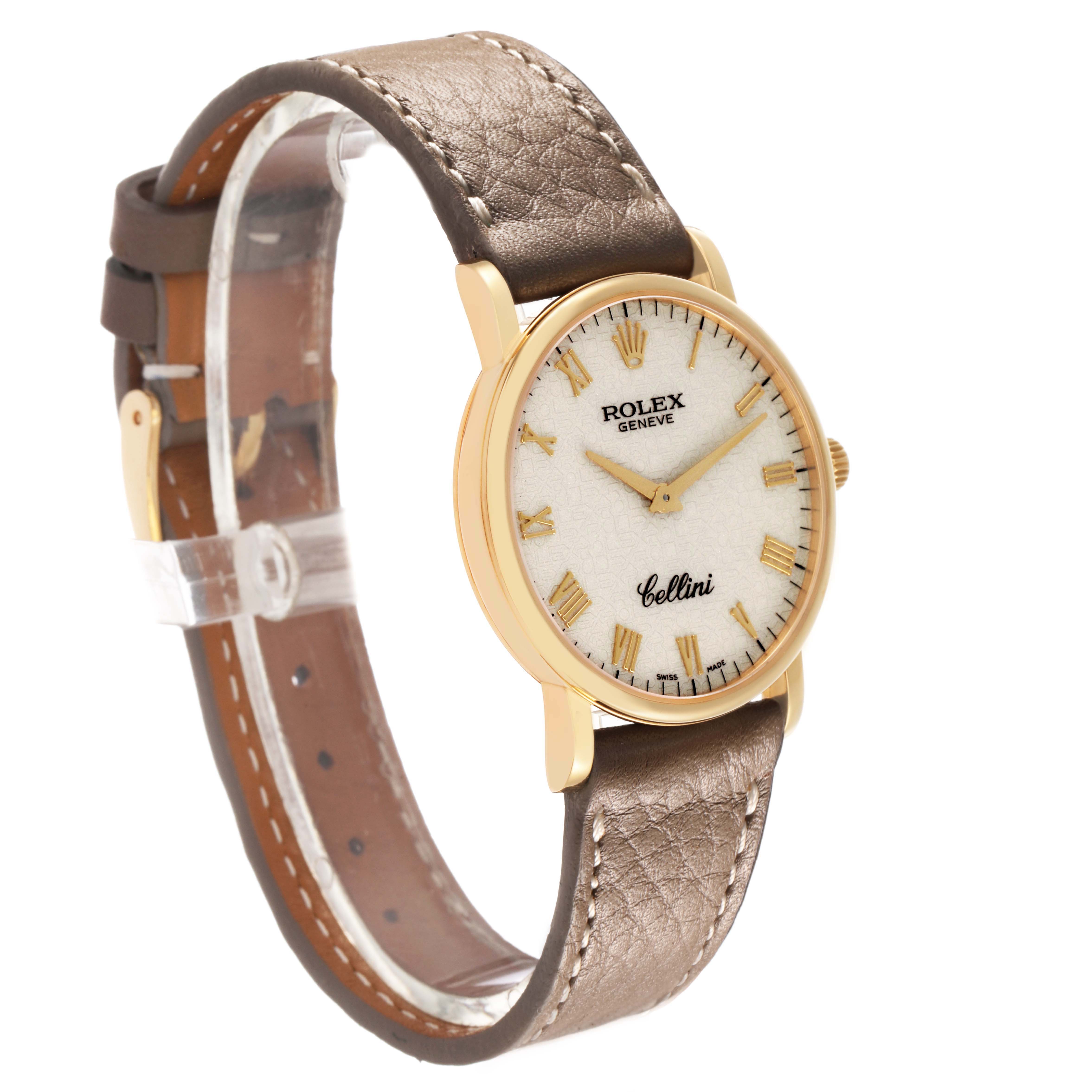 The Rolex Cellini 5115/8 Men's Yellow Gold White Dial watch is shown at an angle displaying the face, crown, case, and leather strap.