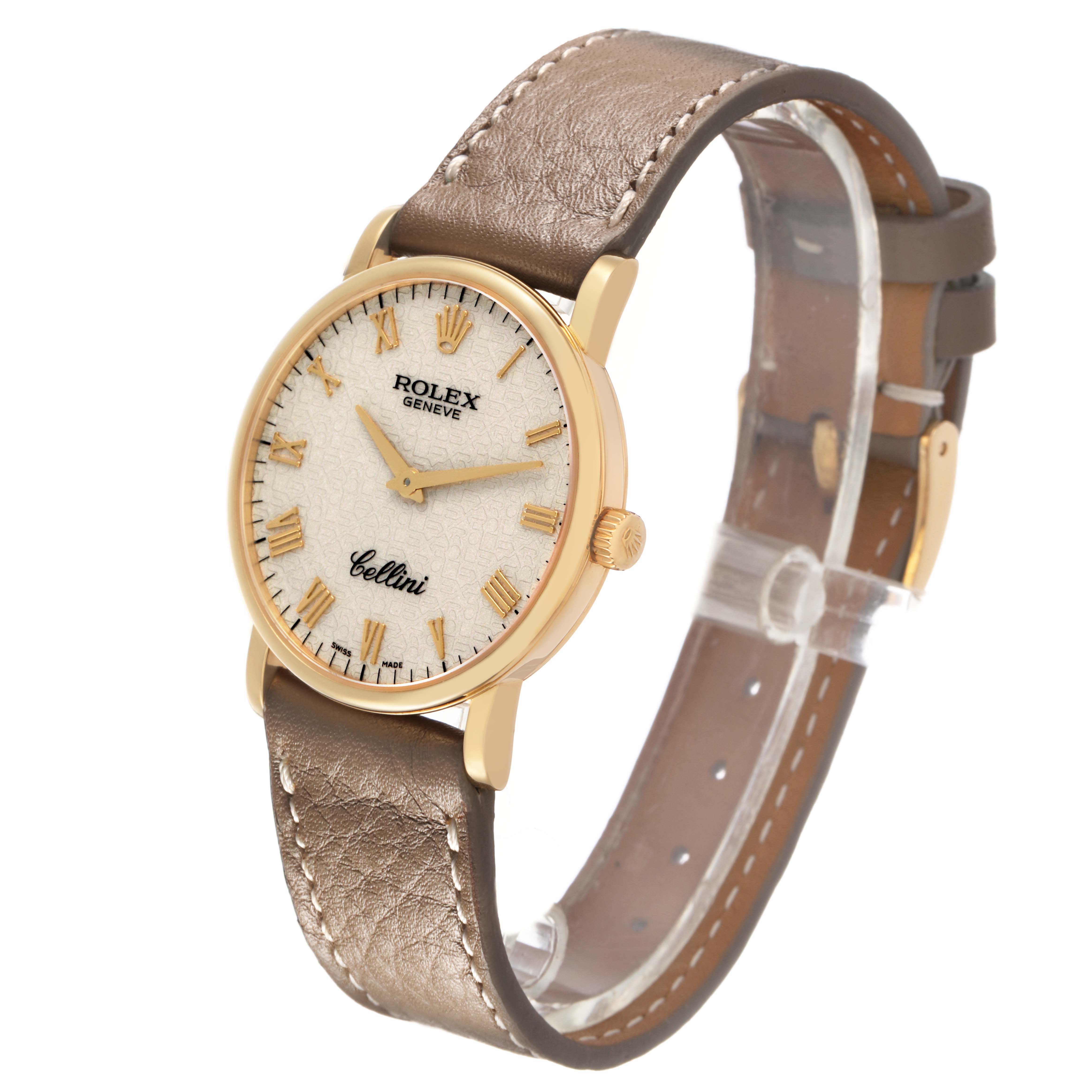 The Rolex Cellini 5115/8 Men's Yellow Gold White Dial watch is shown at a three-quarter angle, highlighting the dial, crown, case, and leather strap.