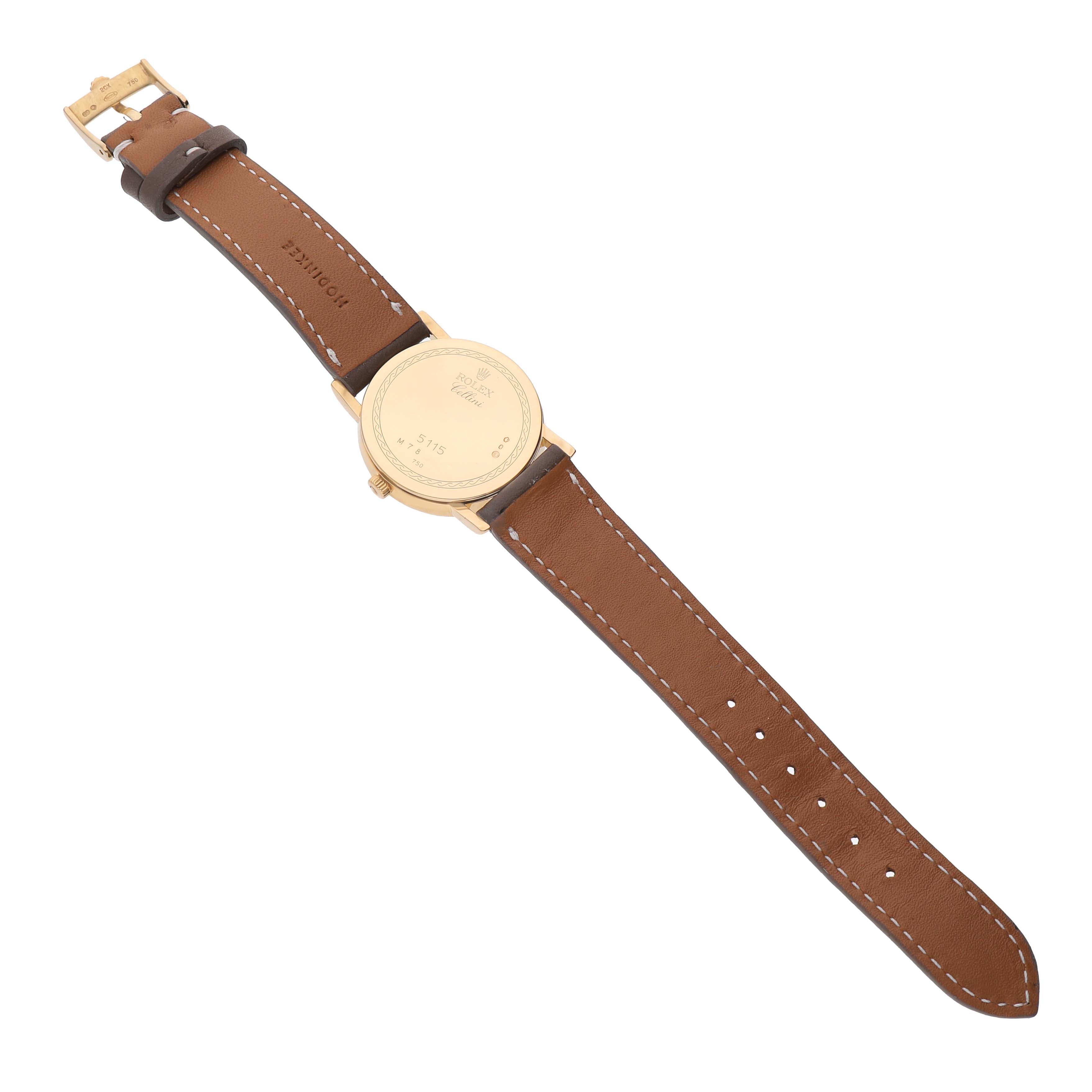 The image shows the back of a Rolex Cellini 5115/8 Men's Yellow Gold White Dial watch, highlighting its leather strap and buckle.