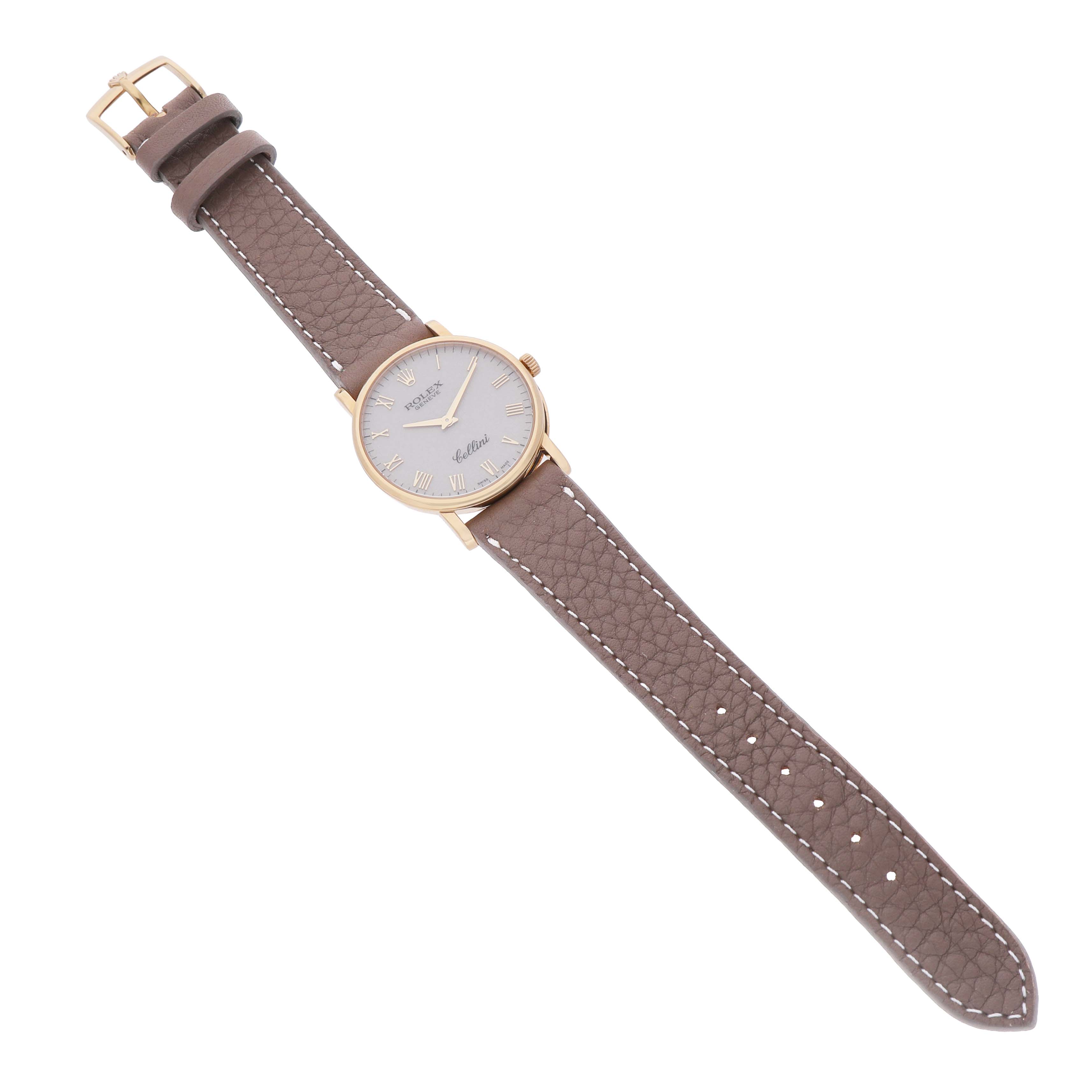 The Rolex Cellini 5115/8 Men's Yellow Gold White Dial watch is shown at a diagonal angle, displaying its face, case, buckle, and leather strap.
