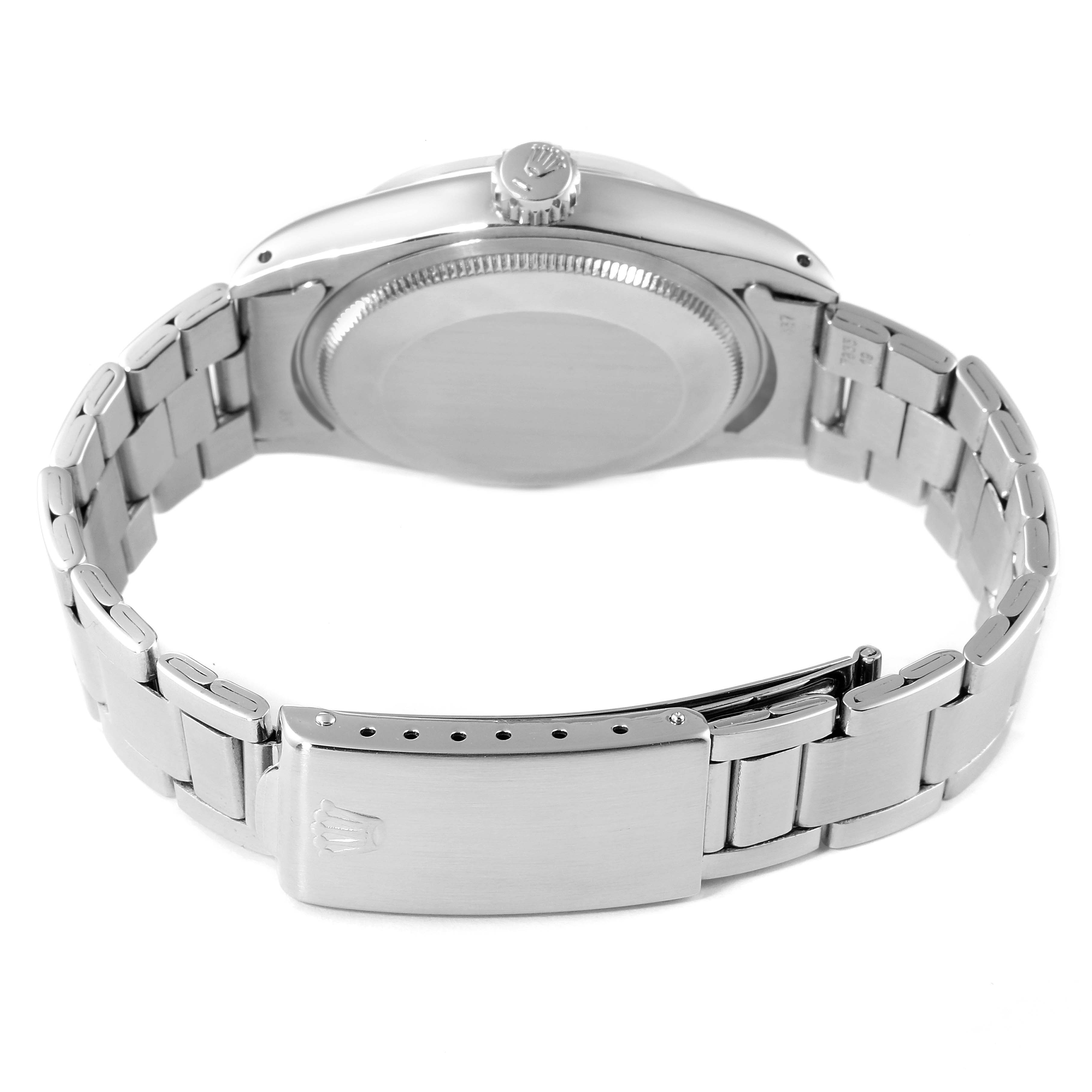 This image shows the back and bracelet of a Rolex Vintage Collection 1500 Men
s Stainless Steel Black Dial 1500 Men
s Stainless Steel Black Dial model watch, with a focus on the clasp and case back.