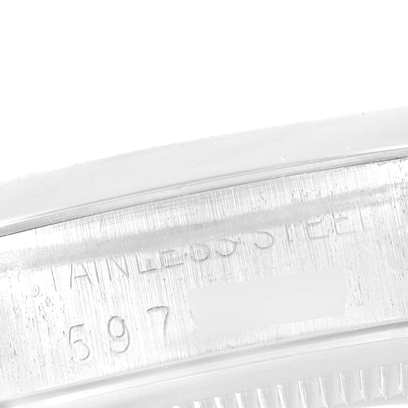 This close-up image shows the engraved stainless steel case back of a Vintage Collection model by Rolex.