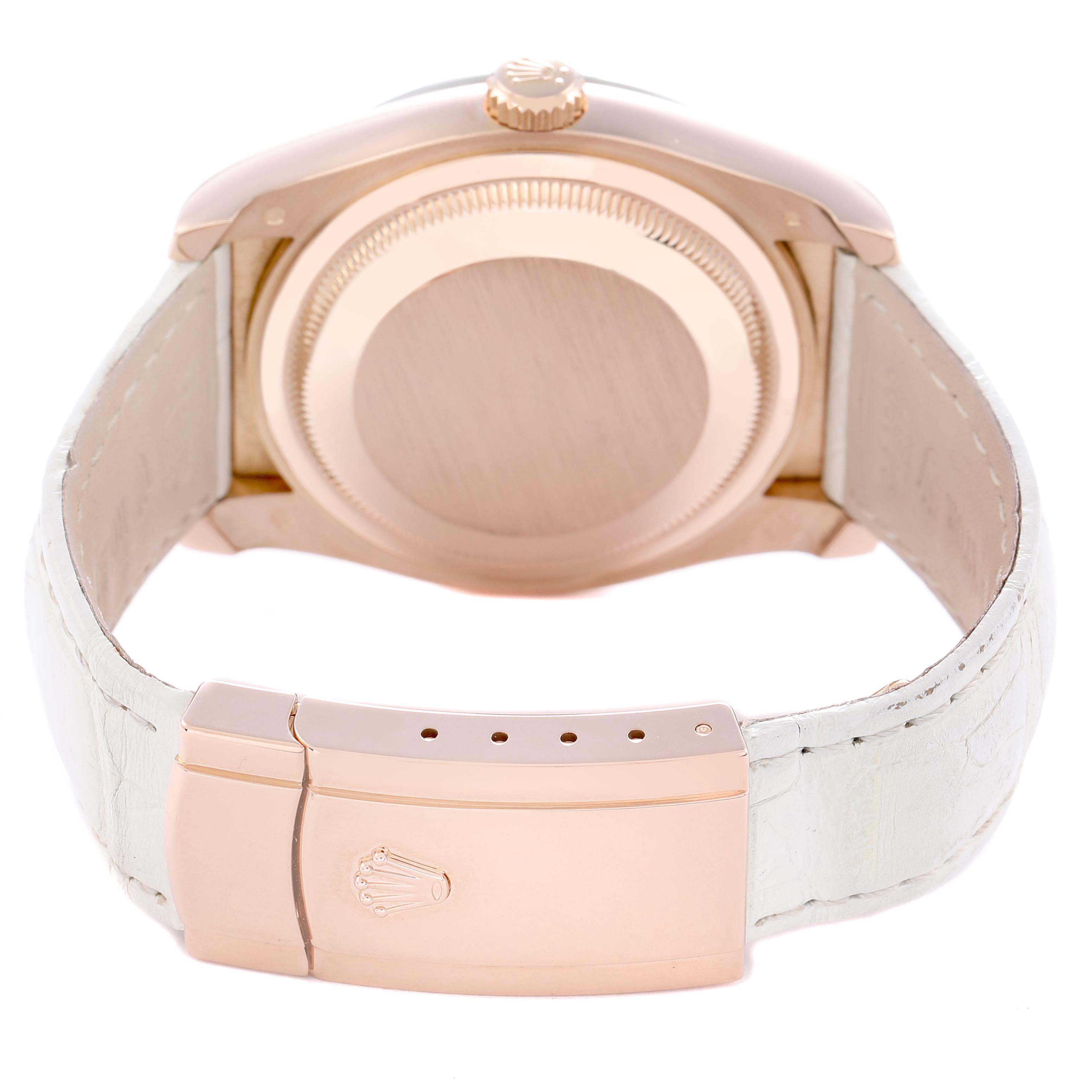 The image shows the back of a Rolex Datejust 116185 Men
s Rose Gold Mother of Pearl Dial, highlighting the case, crown, and closed clasp with a white strap.