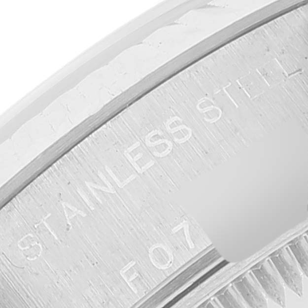 This close-up angle shows the stainless steel bezel and part of the case back of the Rolex Datejust 79174 Women
s Stainless Steel Pink Dial 79174 Women
s Stainless Steel Pink Dial watch.