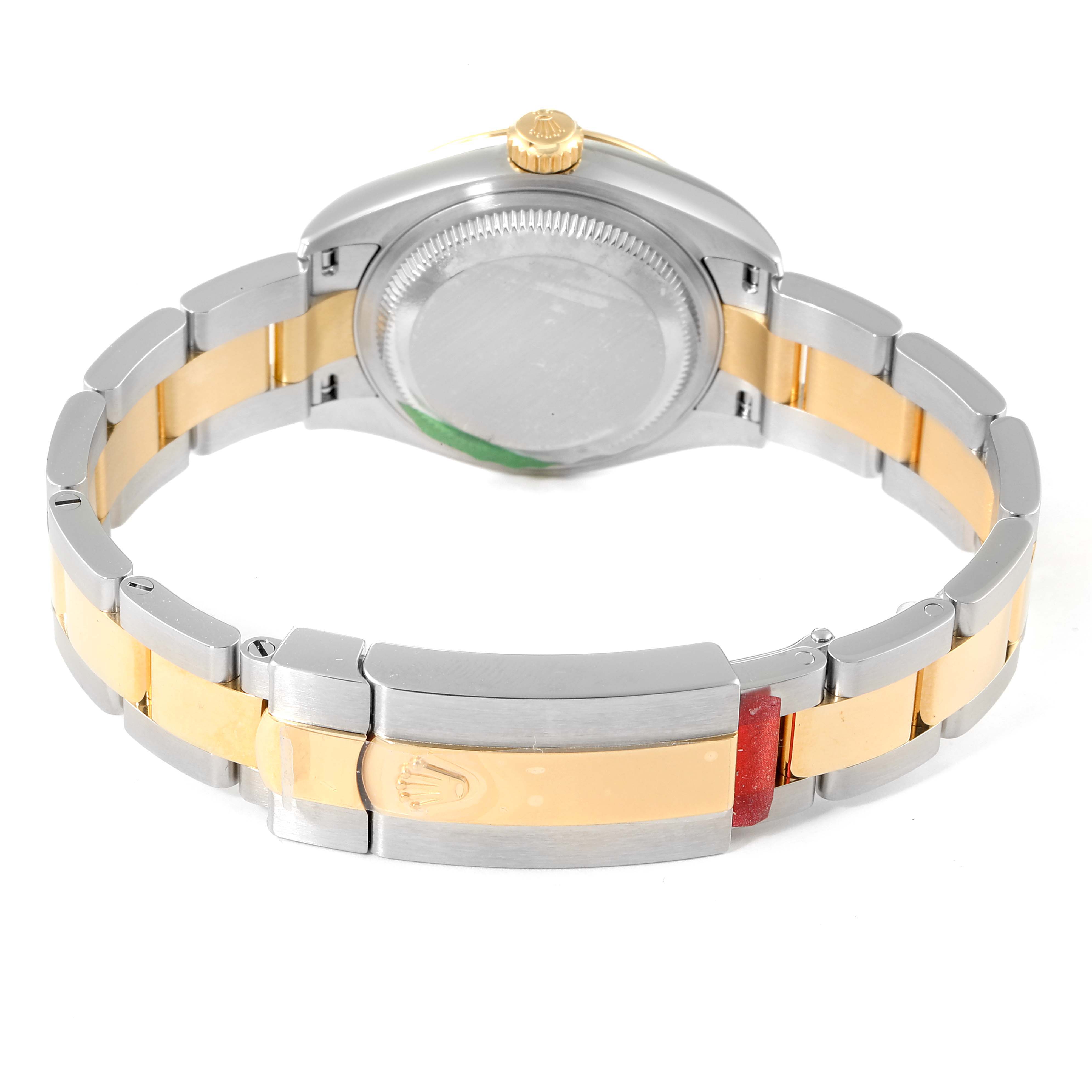 The image shows the back of a Datejust model by Rolex, highlighting the case, bracelet, and clasp.