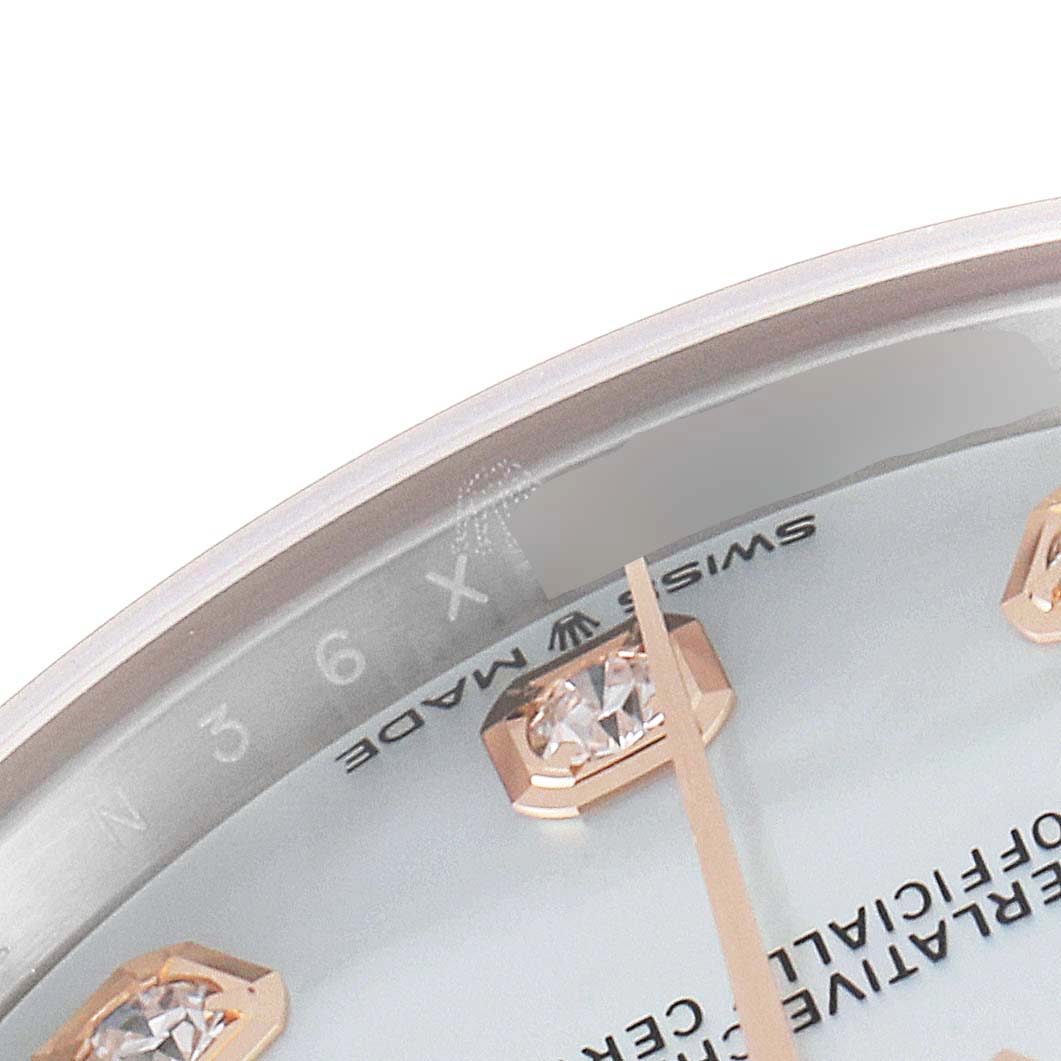 This image shows a close-up of the dial, markers, and part of the bezel of a Mid-Size Rolex watch.