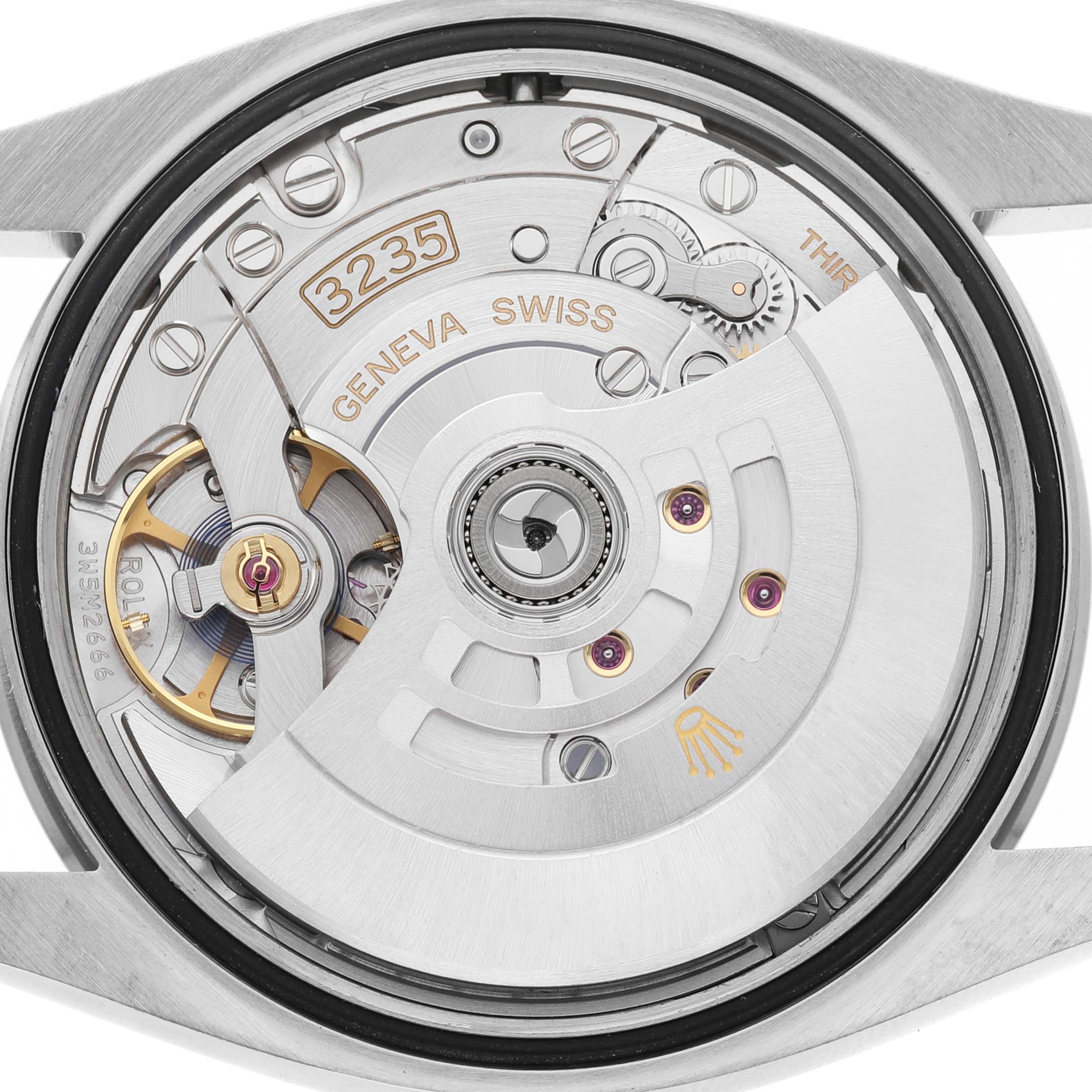 The image shows the movement mechanism of a Rolex Datejust 126200 Men's Stainless Steel Green Dial watch, viewed from the back.